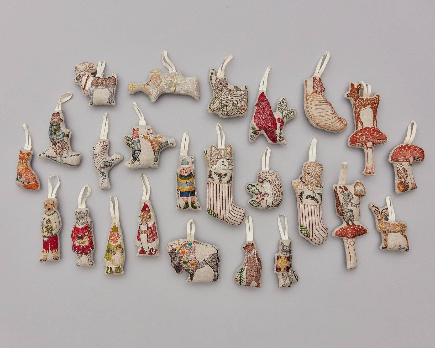 Collection of small ceramic figurines on a gray background