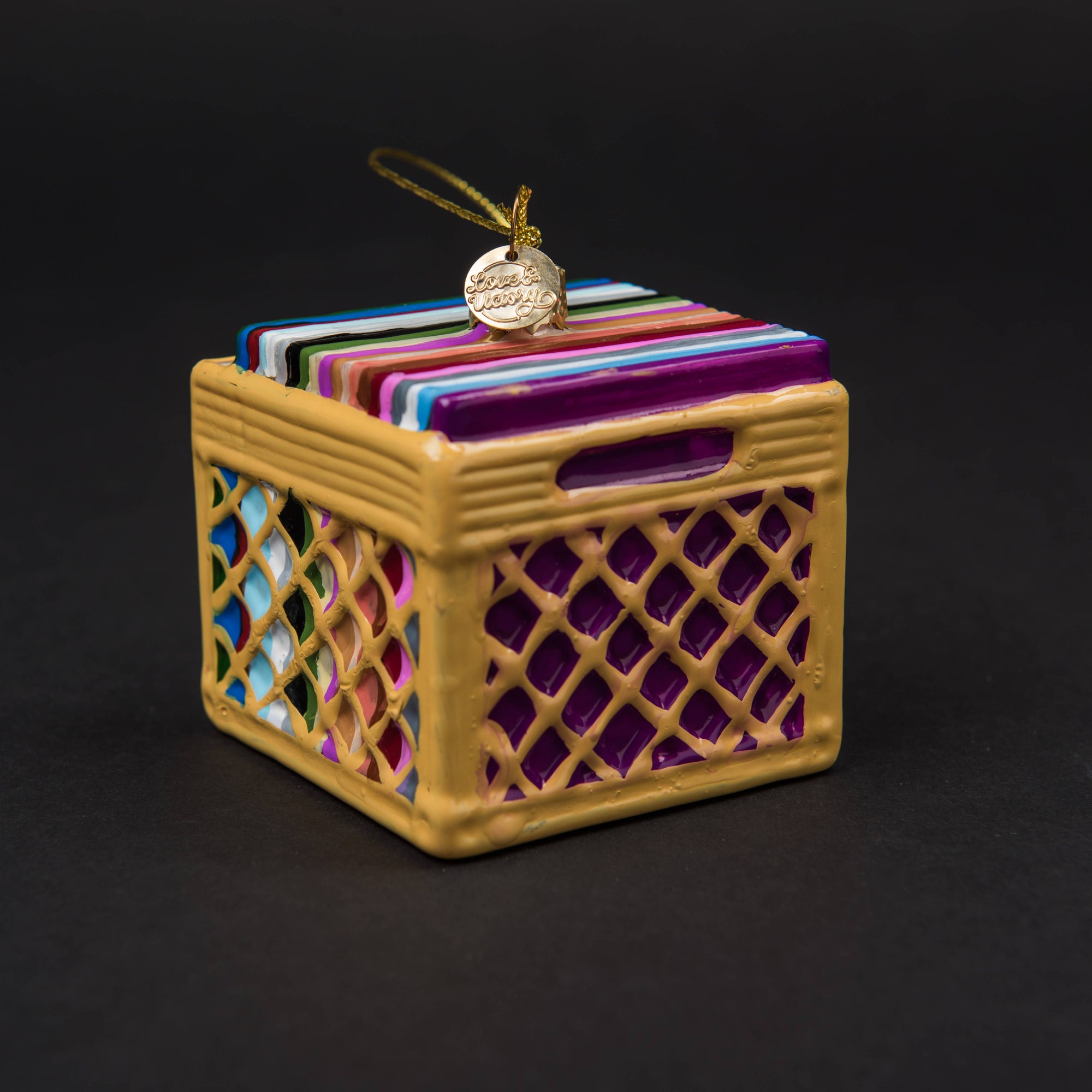 Decorative box with colorful lids on a black background
