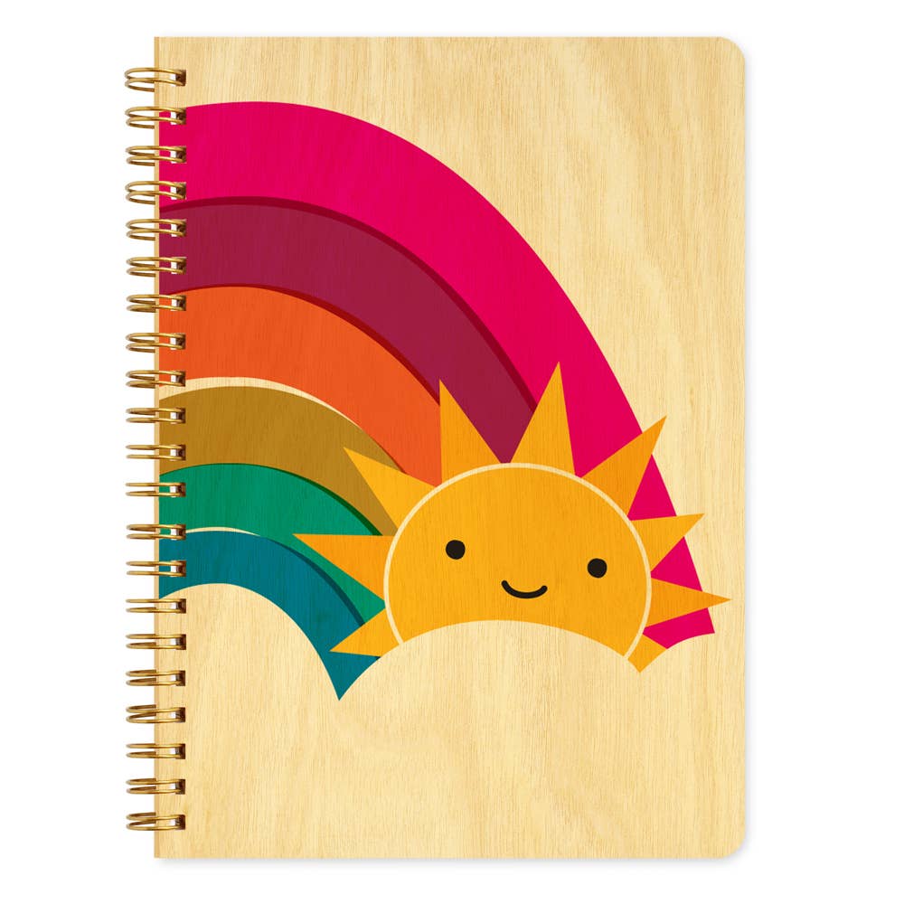 Notebook with a colorful rainbow design and a smiling sun on a white background