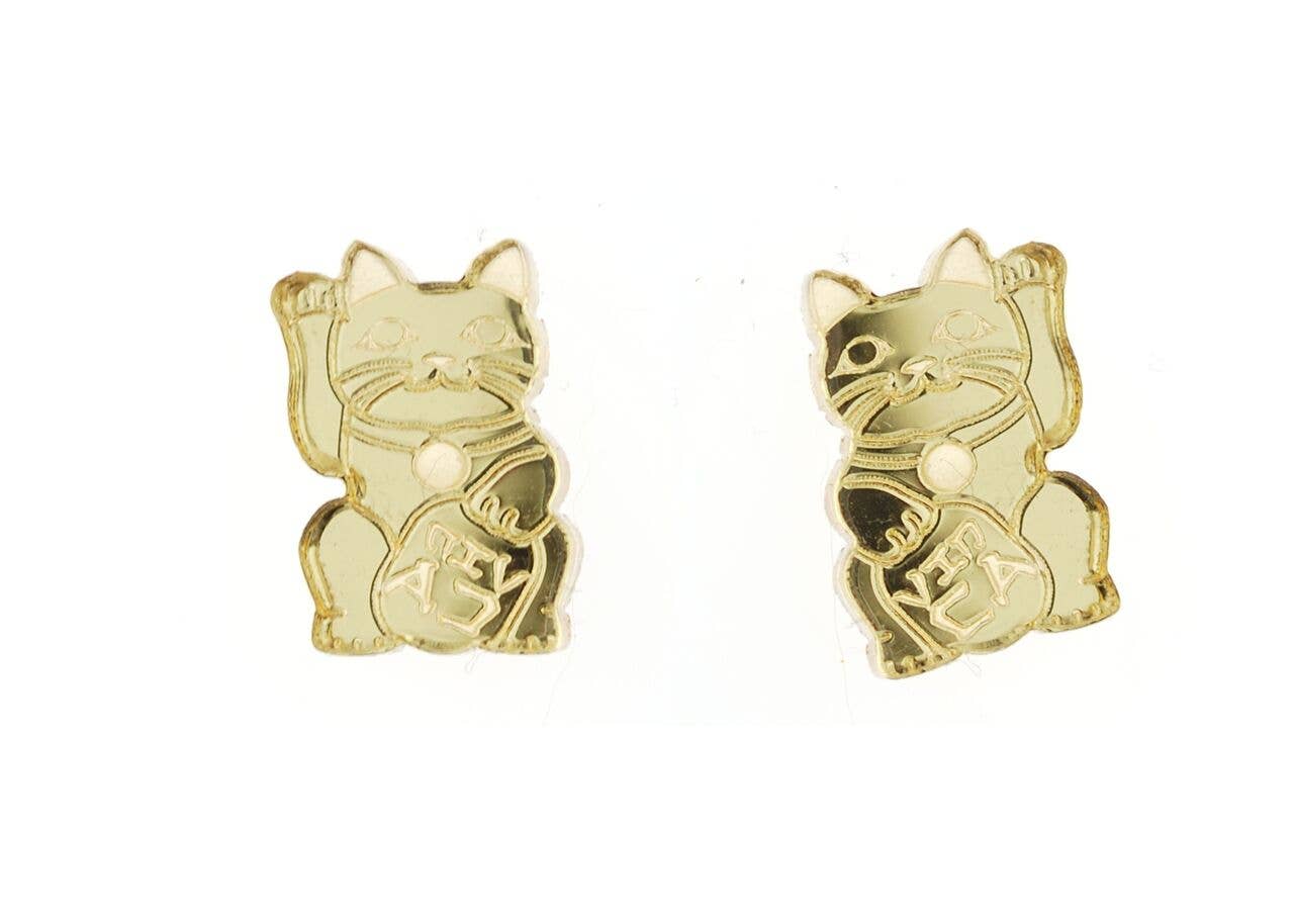 Gold cat-shaped earrings on a white background