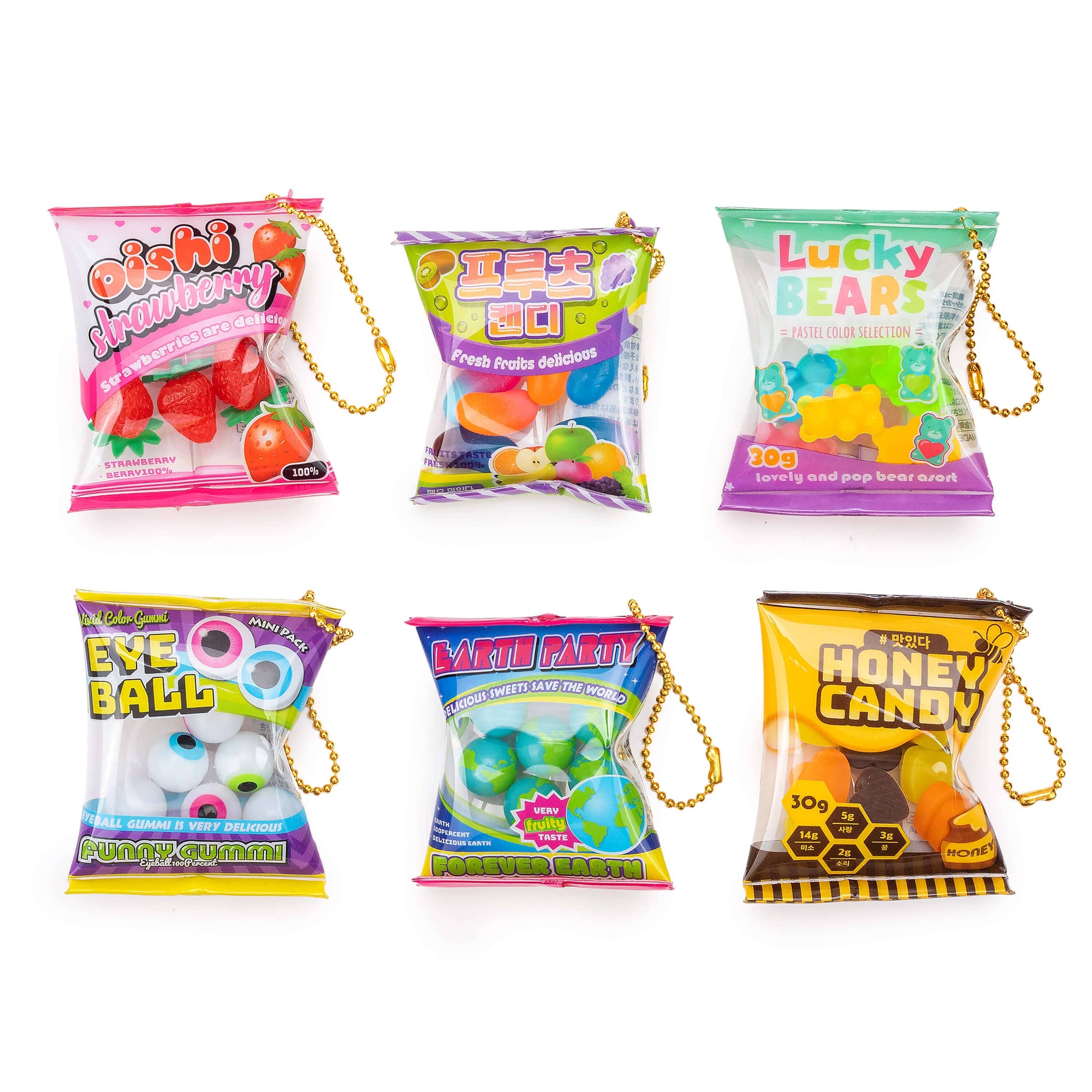 Assorted toy candy packages with colorful packaging and hanging loop on a white background
