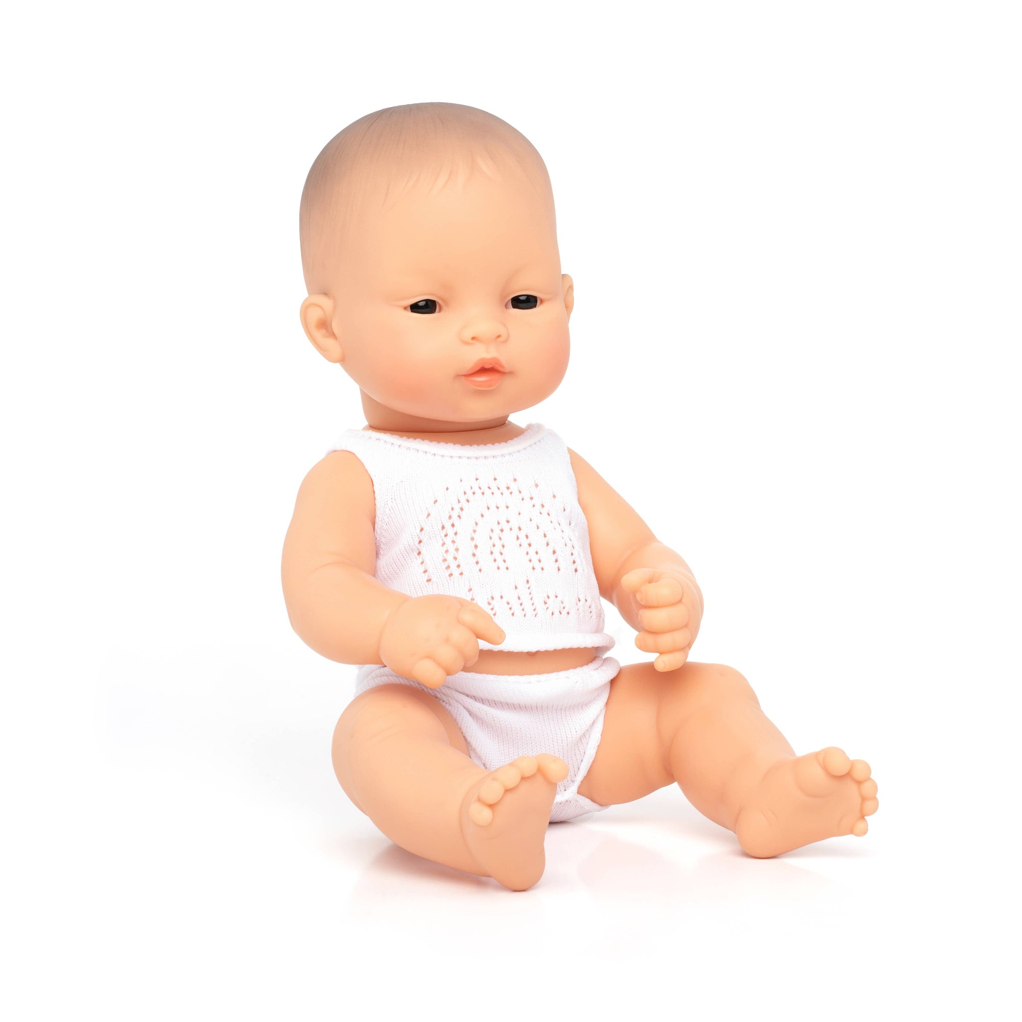 Baby doll with a white outfit on a white background