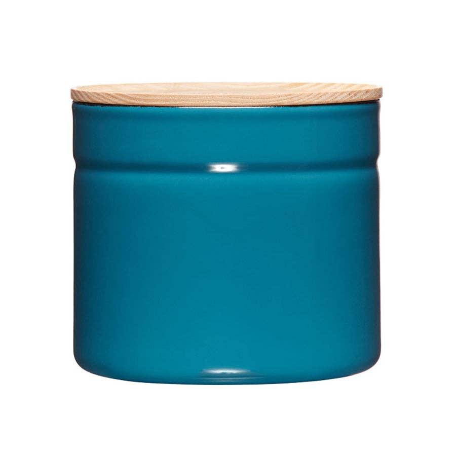 Blue metal jar with a wooden lid on a white background