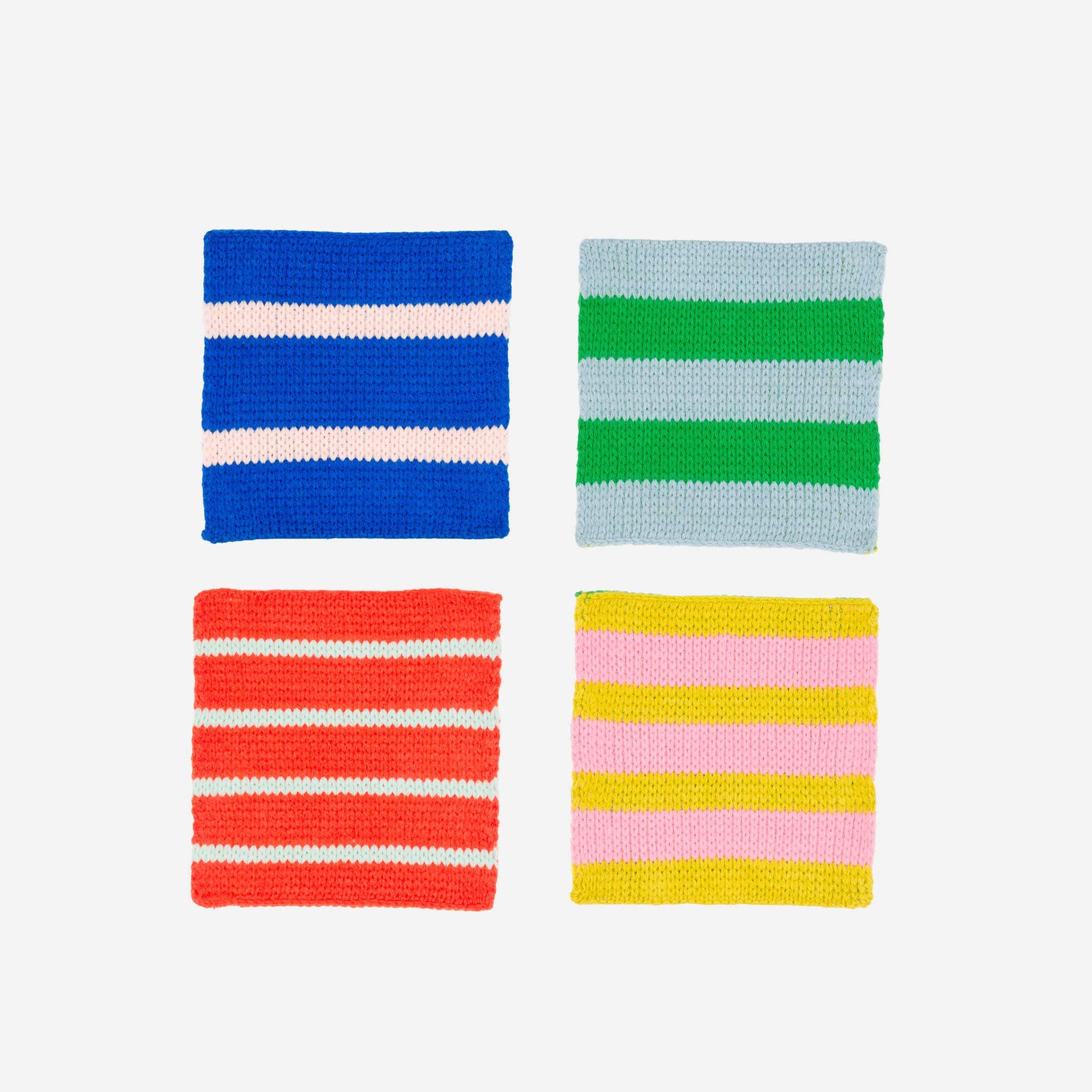 Four knitted swatches with different color patterns on a white background