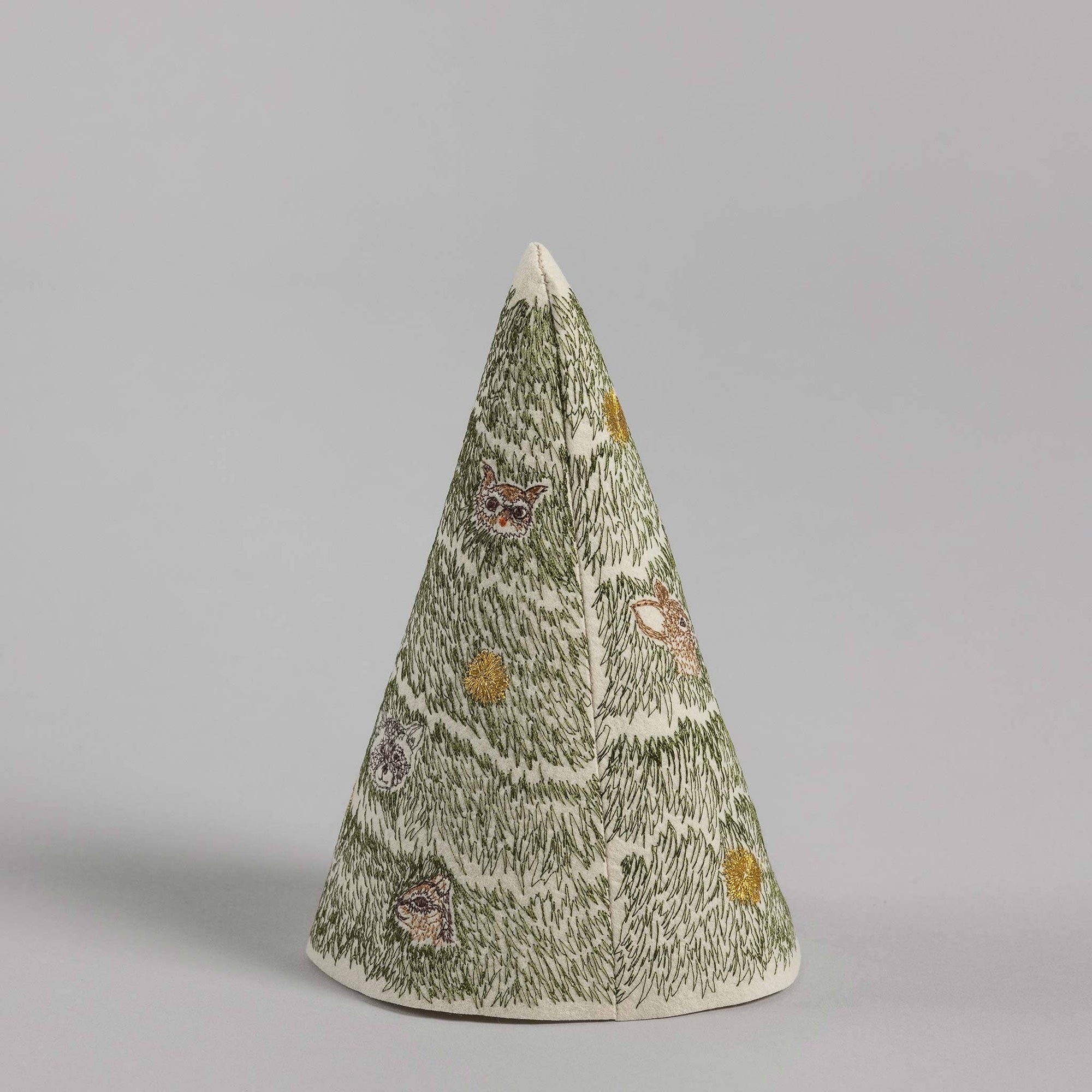 Decorative cone-shaped object with a pattern on a gray background