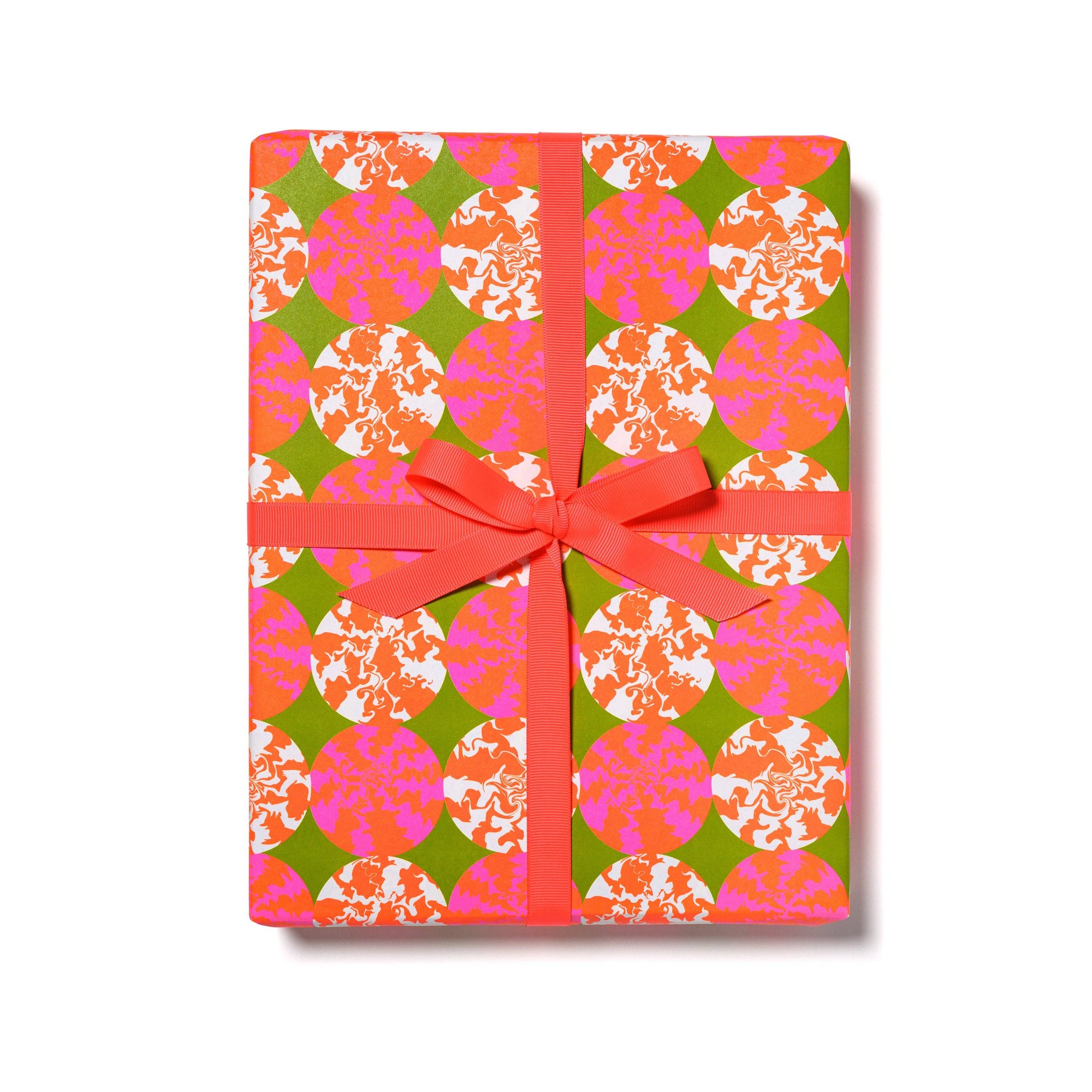 Gift box with colorful pattern and pink ribbon on a white background