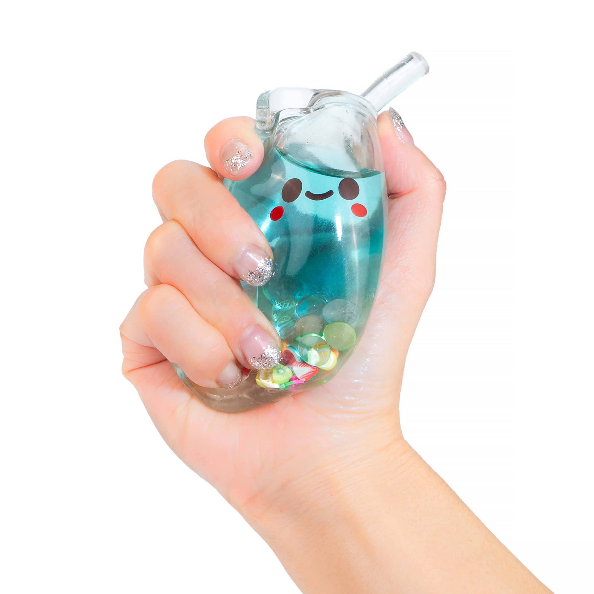 Hand holding a blue tumbler with a smiley face design on a white background