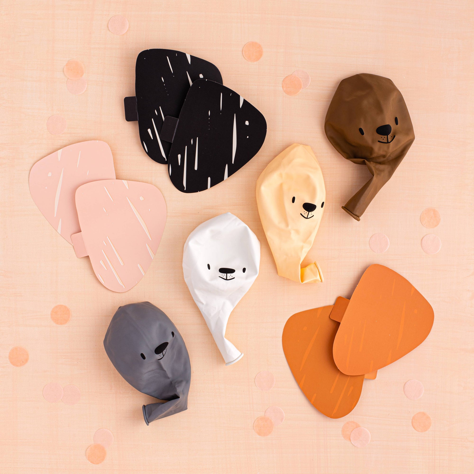 Set of animal-shaped balloons on a pink background