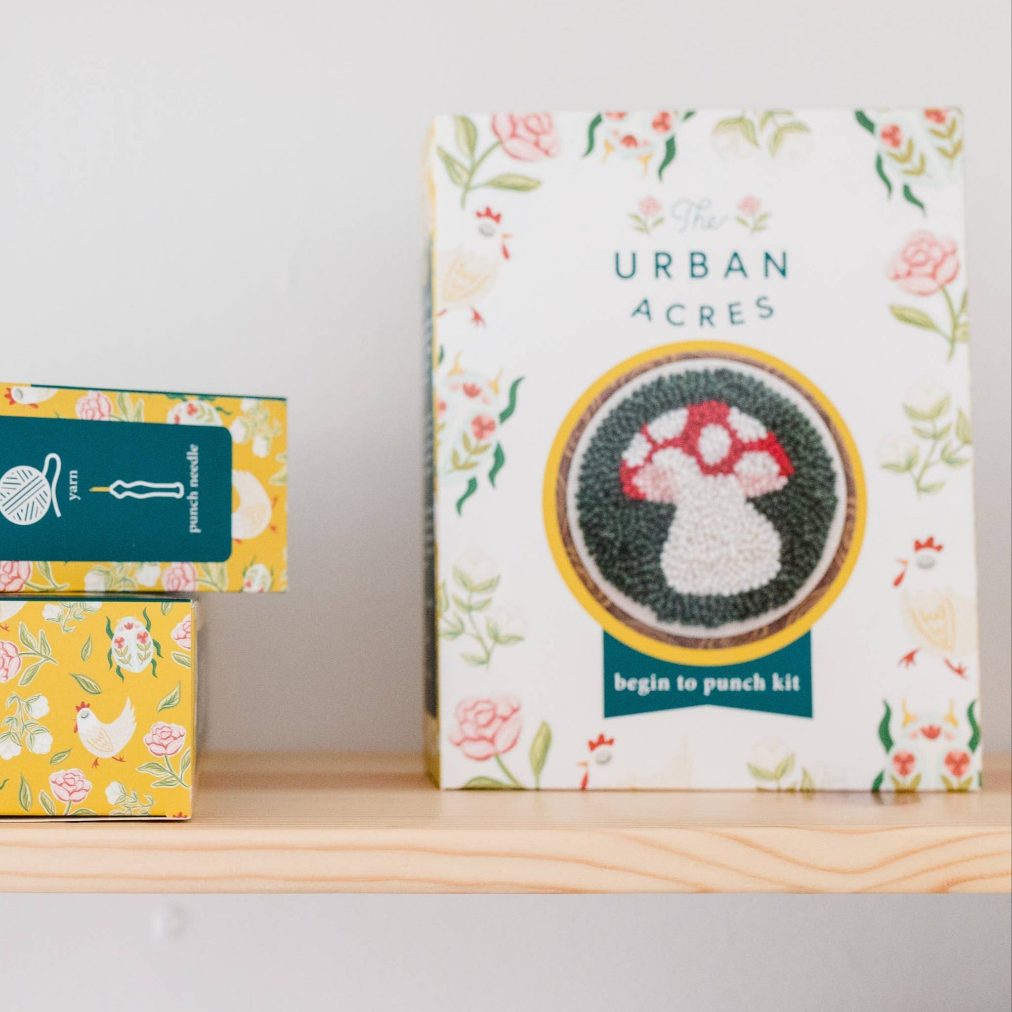 Two boxes from Urban Acres on a shelf with a white background