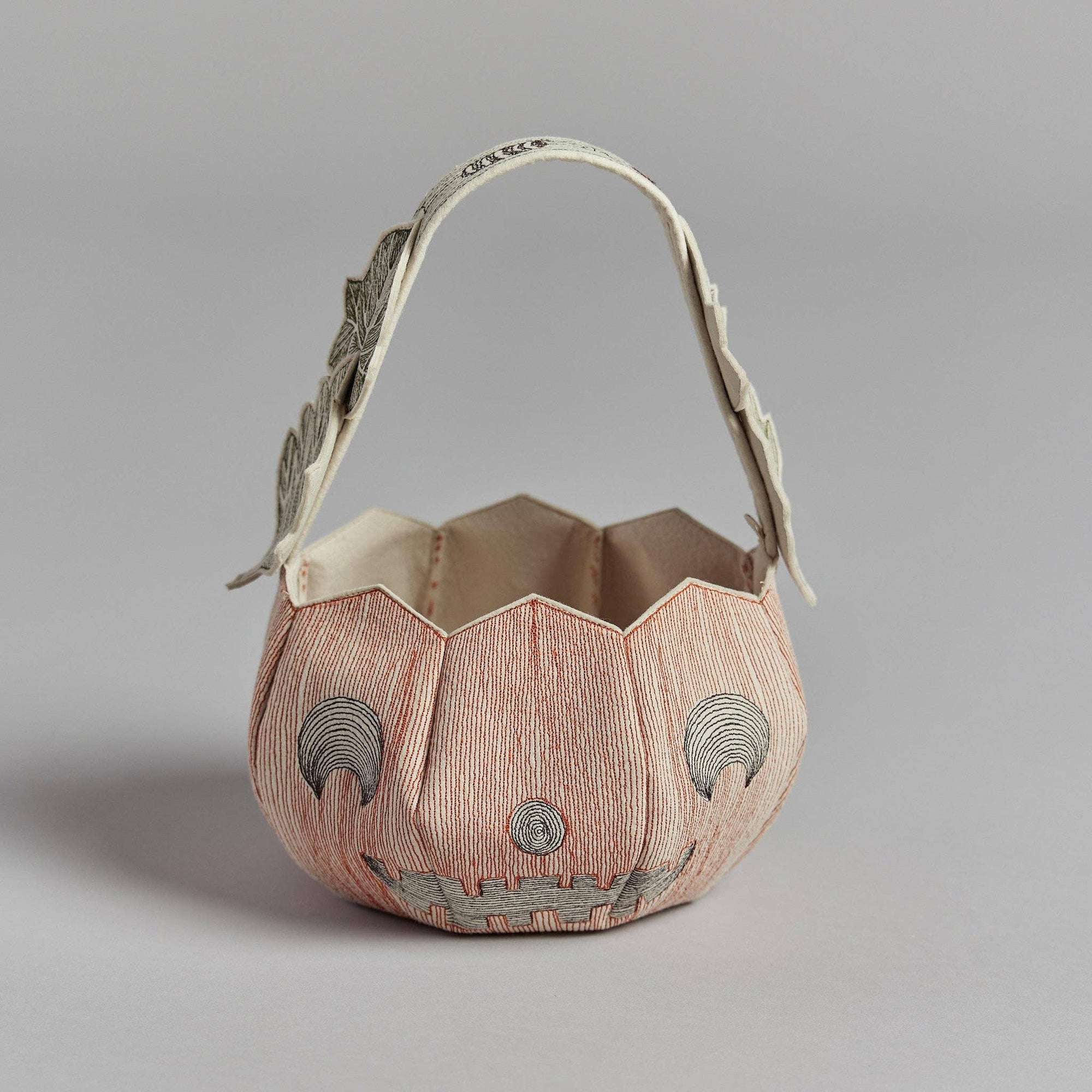 Decorative handbag with geometric design on a gray background