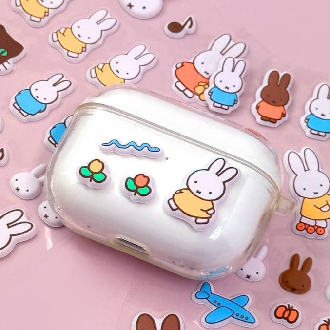 Clear case with cartoon rabbit design on a pink background with cartoon characters.