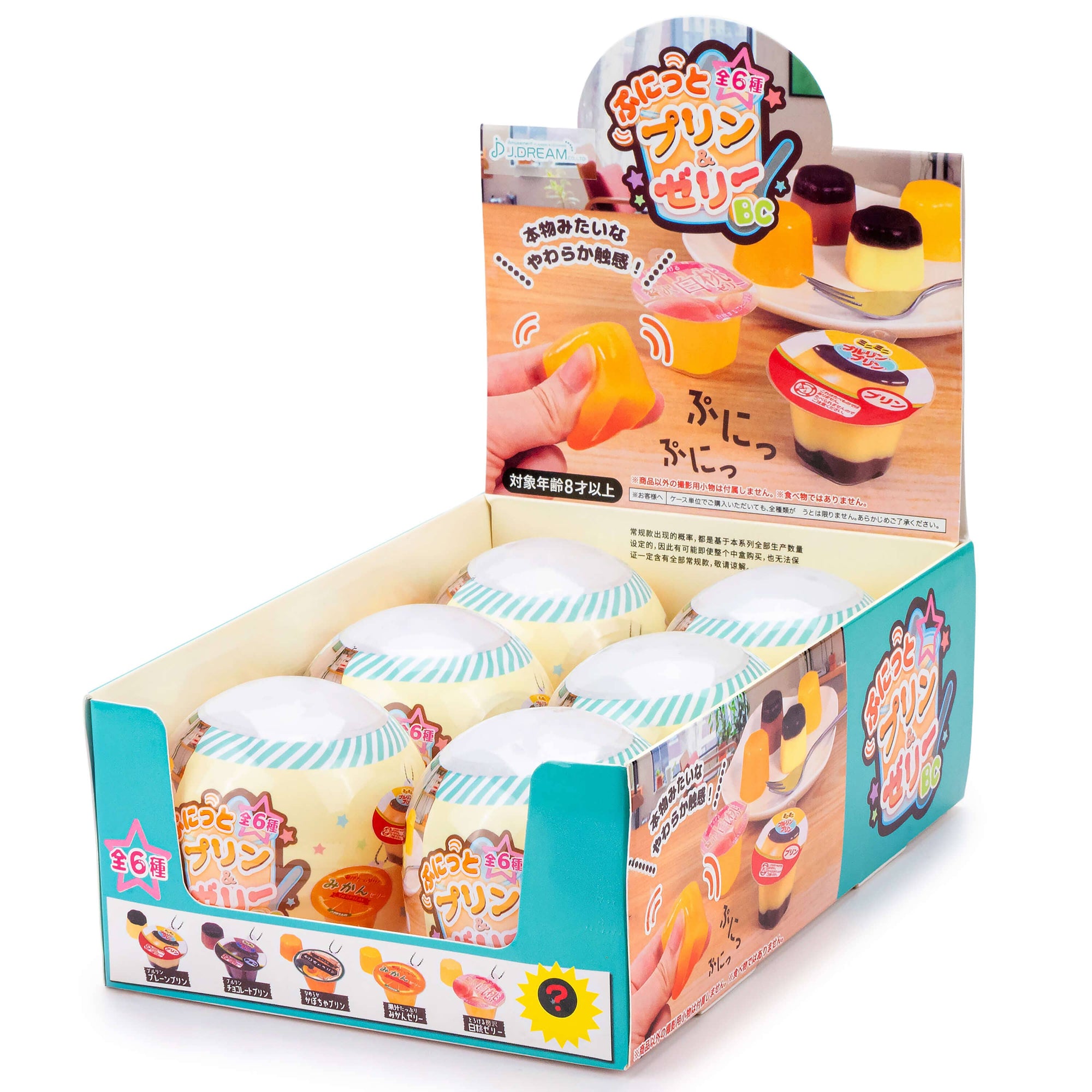Box of small dessert-like products with colorful packaging on a white background