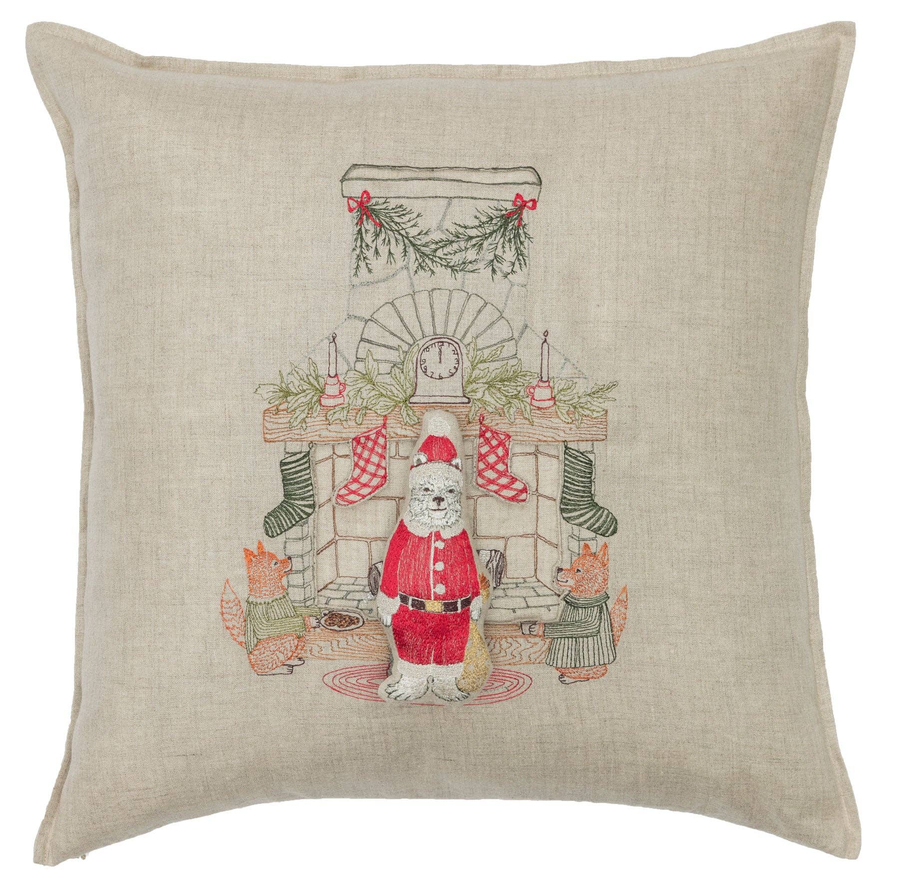Decorative pillow with a festive design featuring Santa Claus and reindeer.