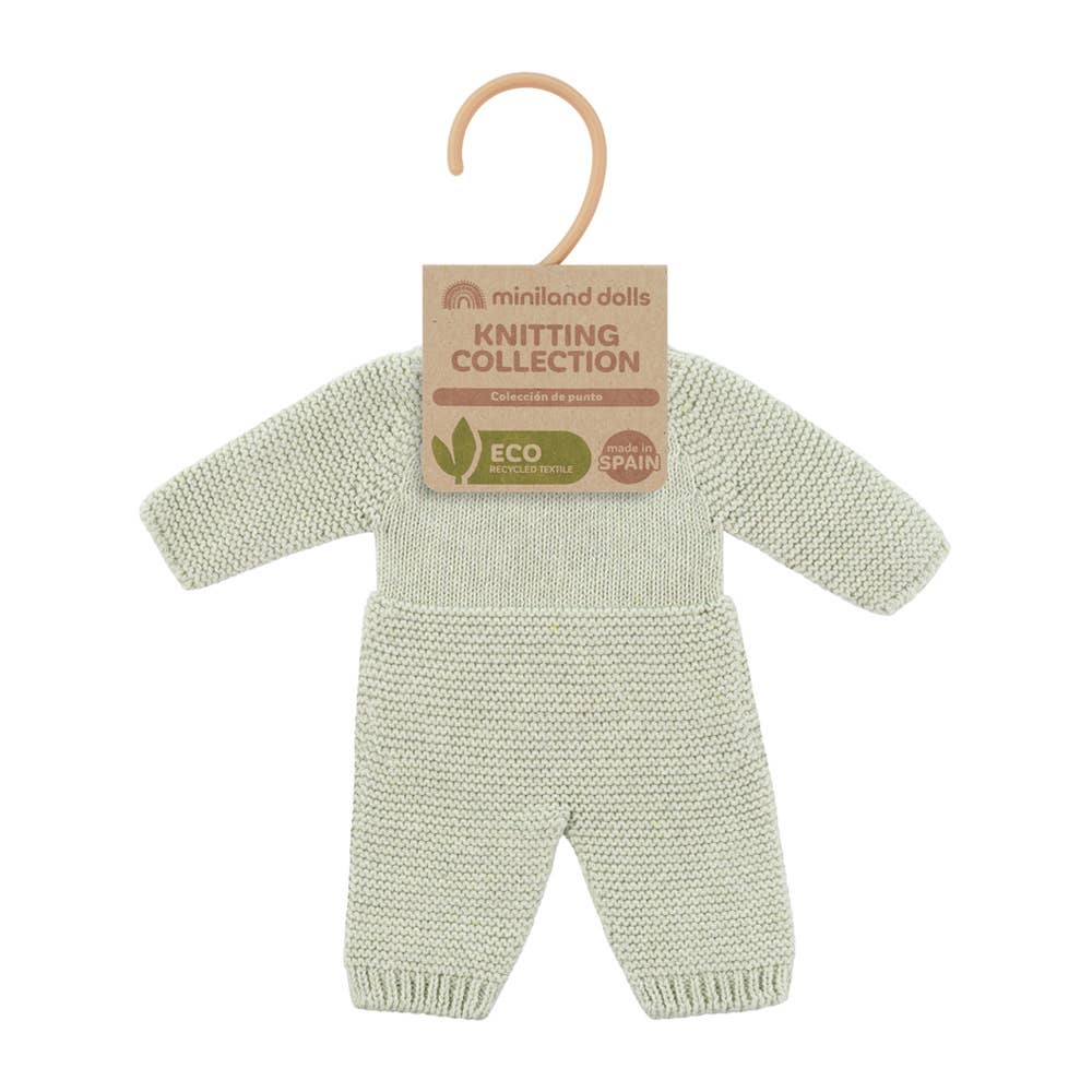 Knitted doll's outfit on a hanger with 'Miniland Dolls' label on a white background