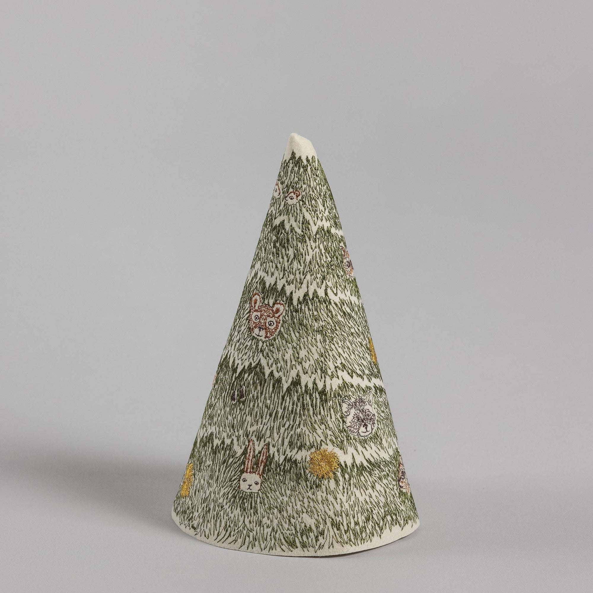 Decorative cone-shaped tree with embroidered animals on a gray background
