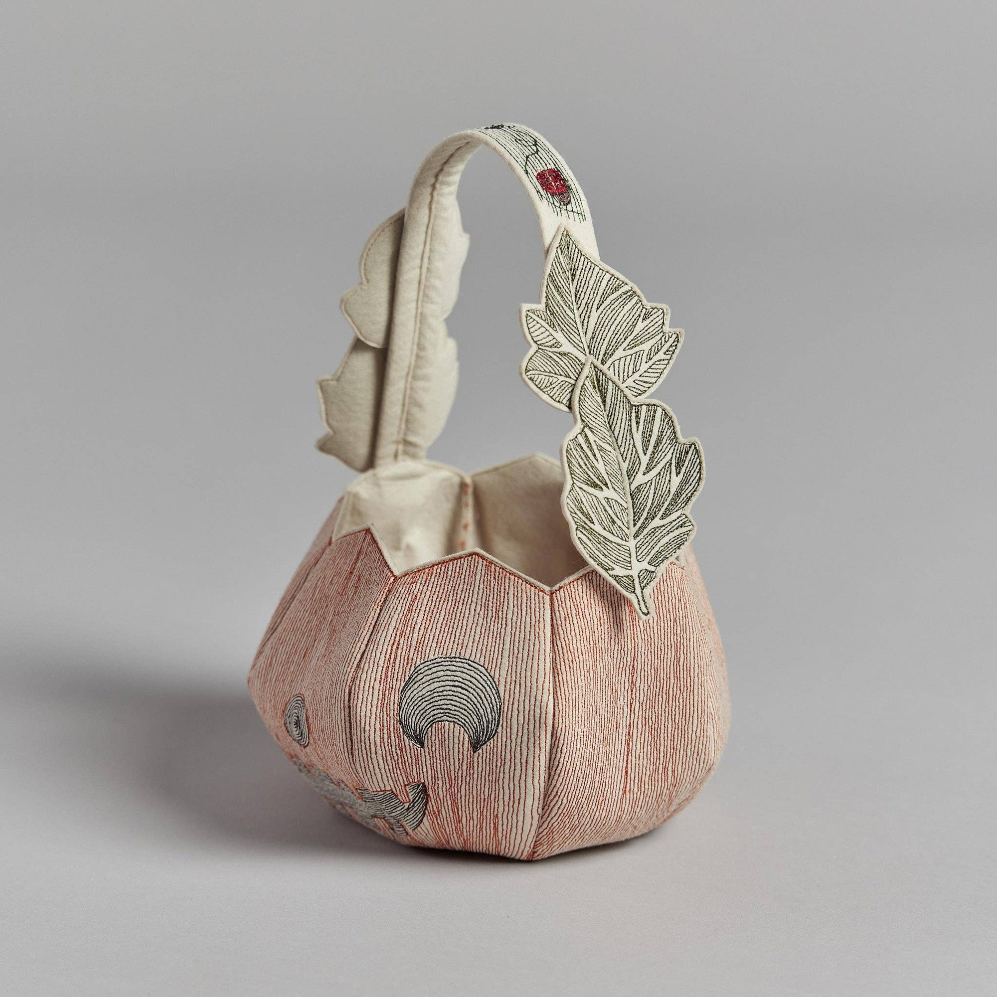 Decorative bag with leaf design on a gray background