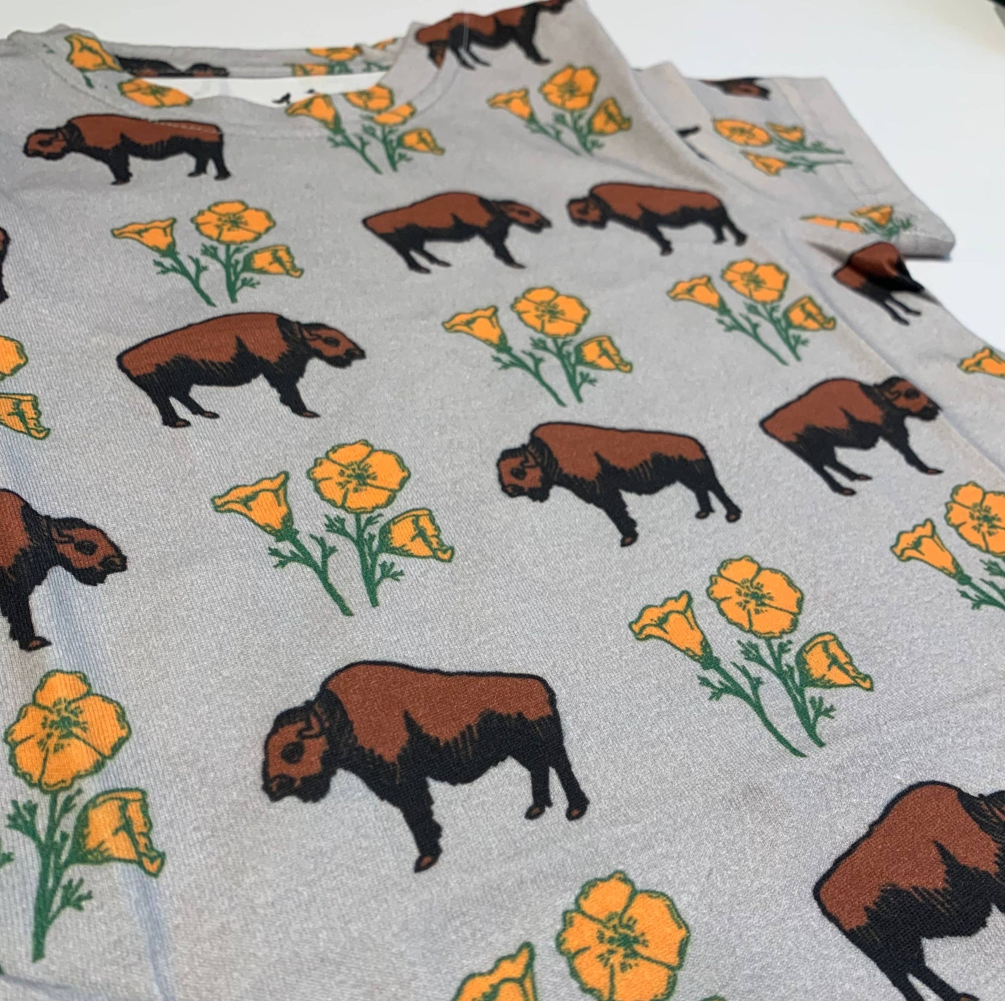 Fabric with bison and flower pattern on a gray background