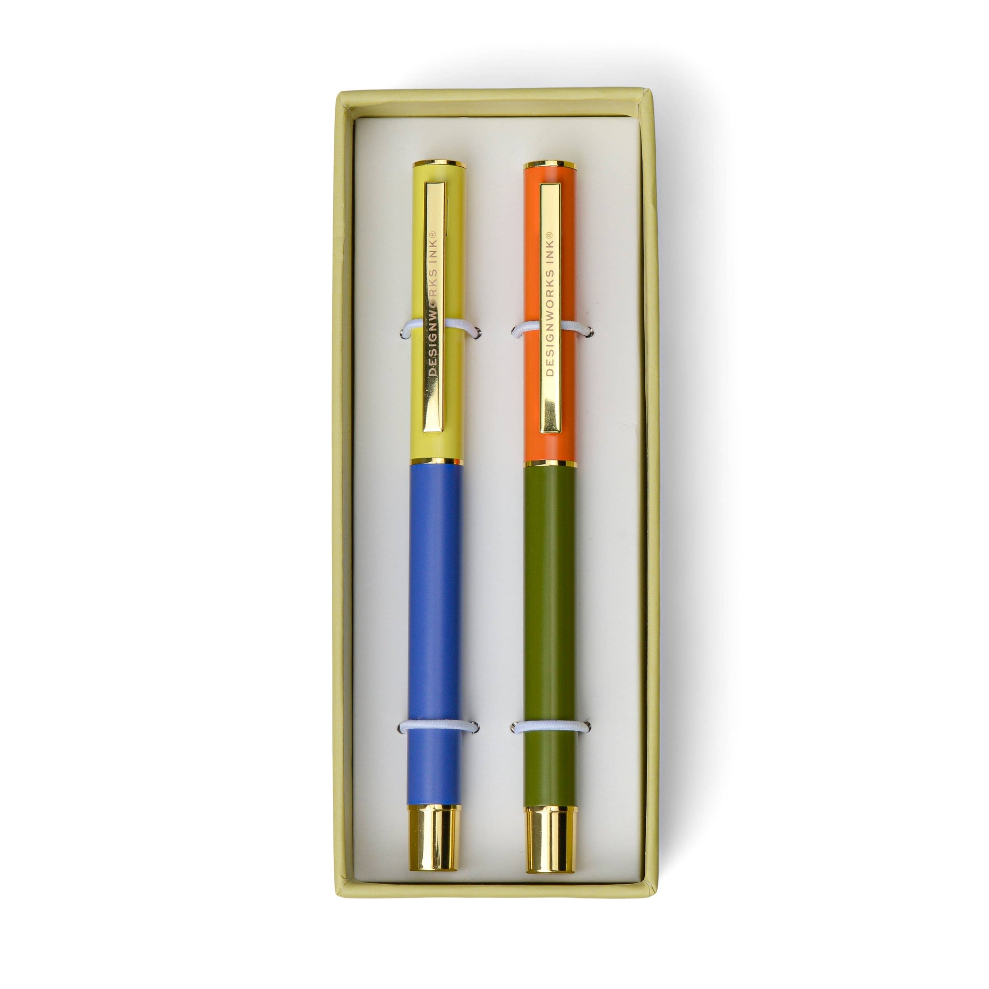 Two pens with colorful barrels in a gold box on a white background