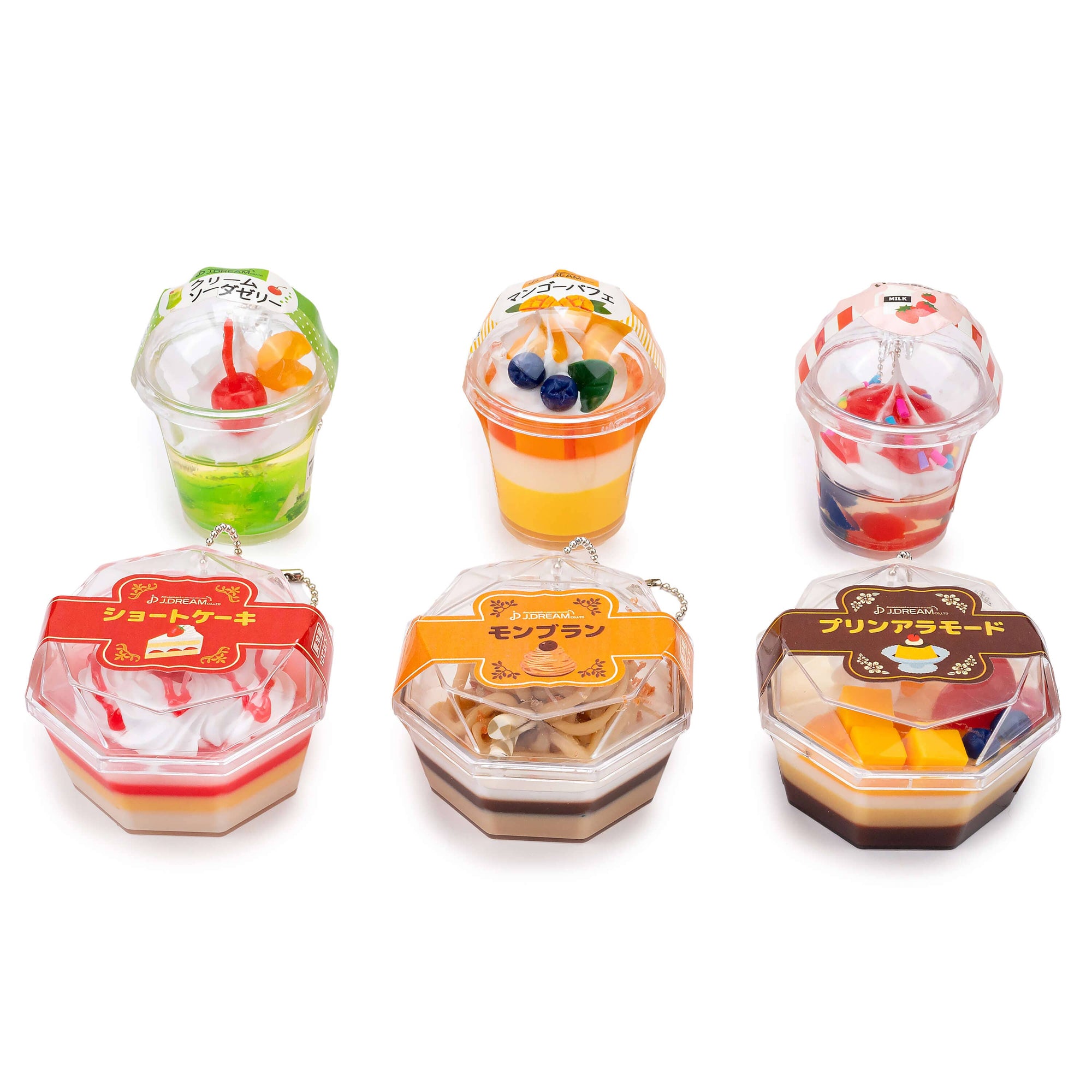 Set of six small toy dessert packages with colorful contents on a white background