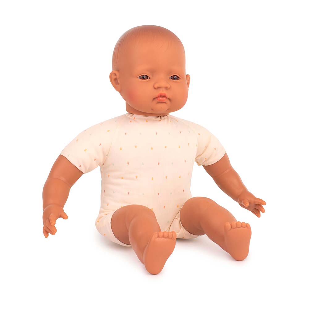 Baby doll with a white onesie on a white background