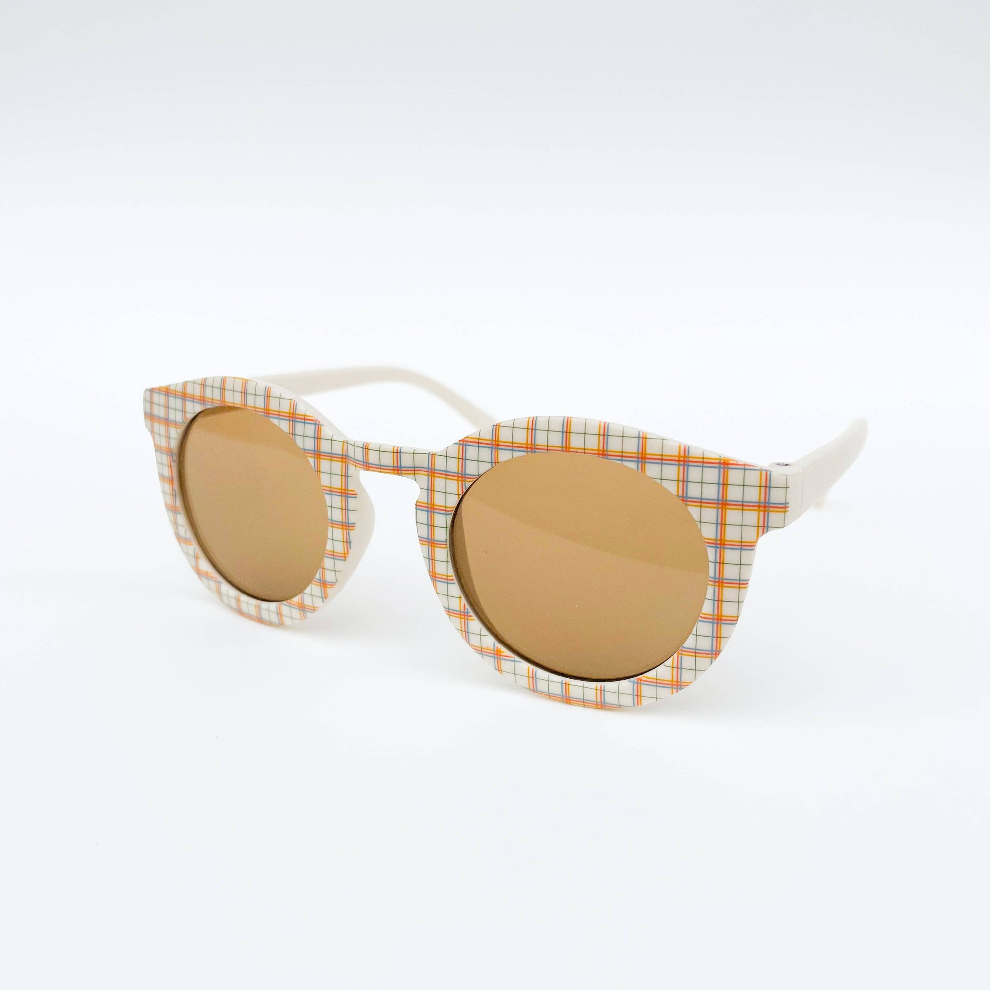 Sunglasses with plaid frame and brown lenses on a white background
