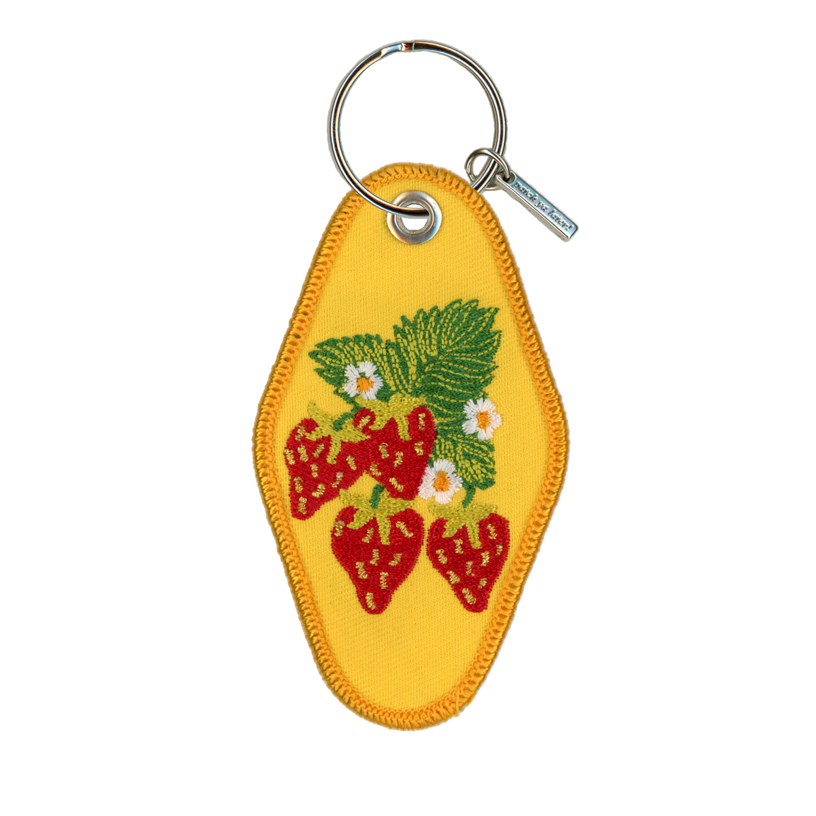 Yellow keychain with strawberry design on a white background