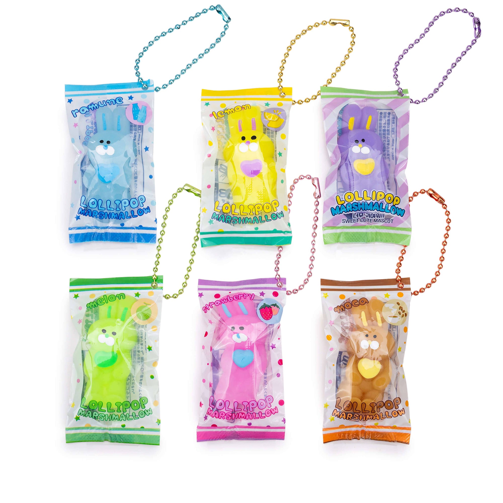 Set of colorful lollipop plush keychains with packaging on a white background