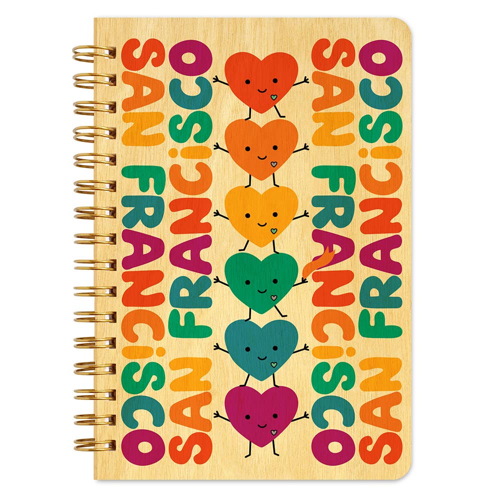 Notebook with colorful heart designs and 'San Francisco' text on a wooden texture background