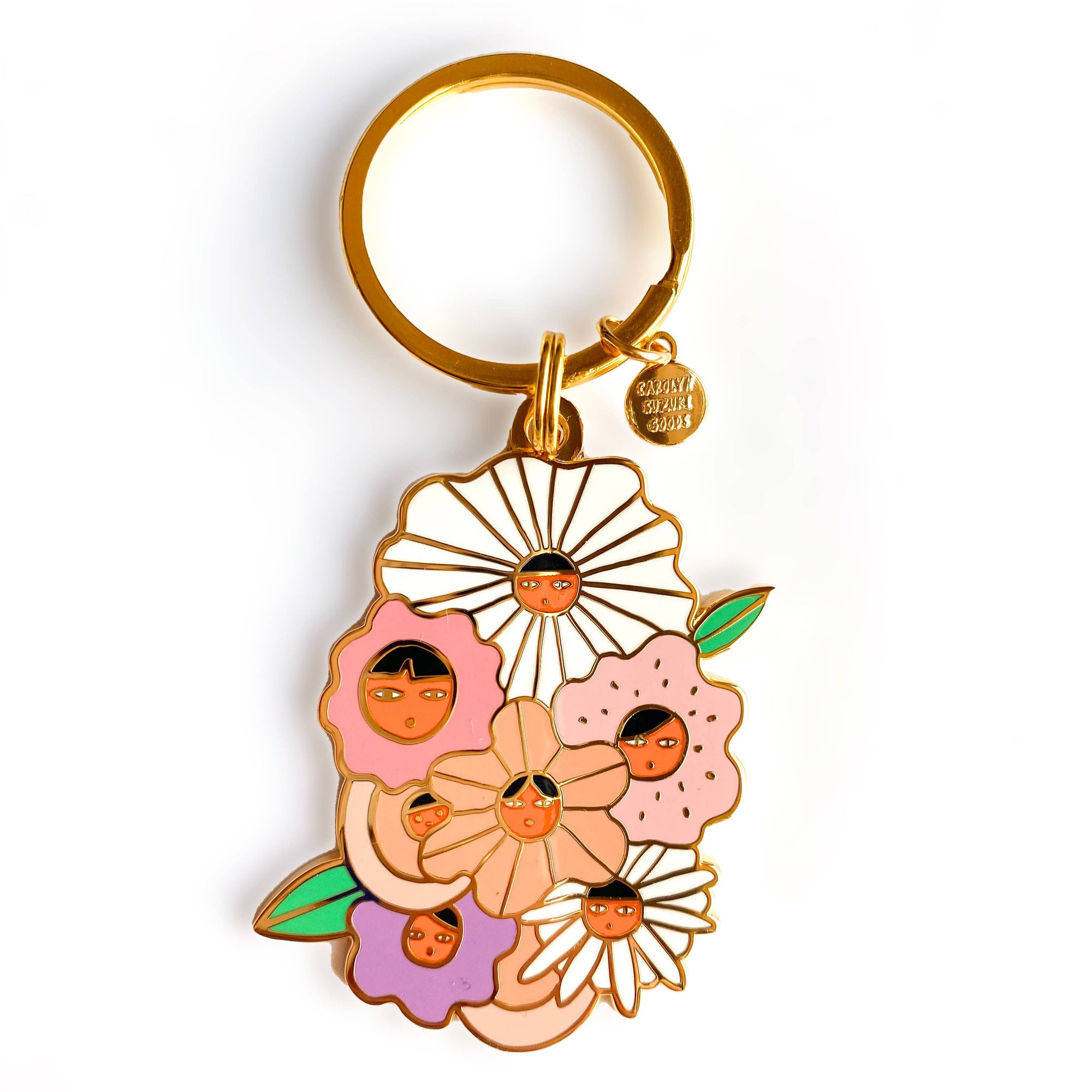 Keychain with floral design and small faces on a white background