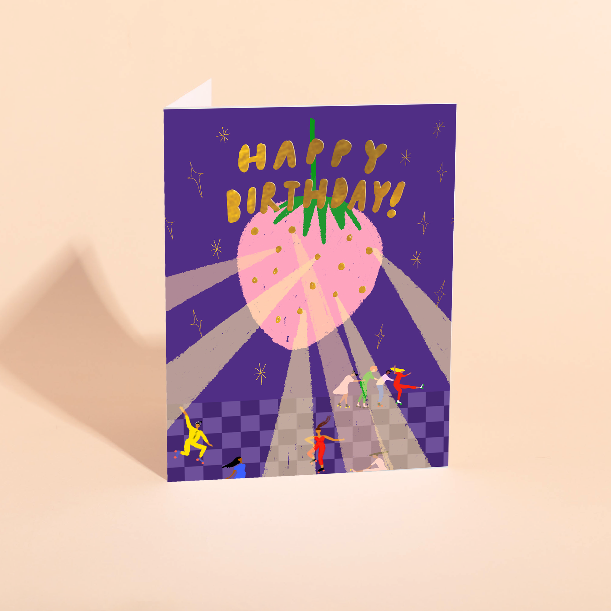 Birthday card with a large pink strawberry and 'Happy Birthday!' text on a purple background.