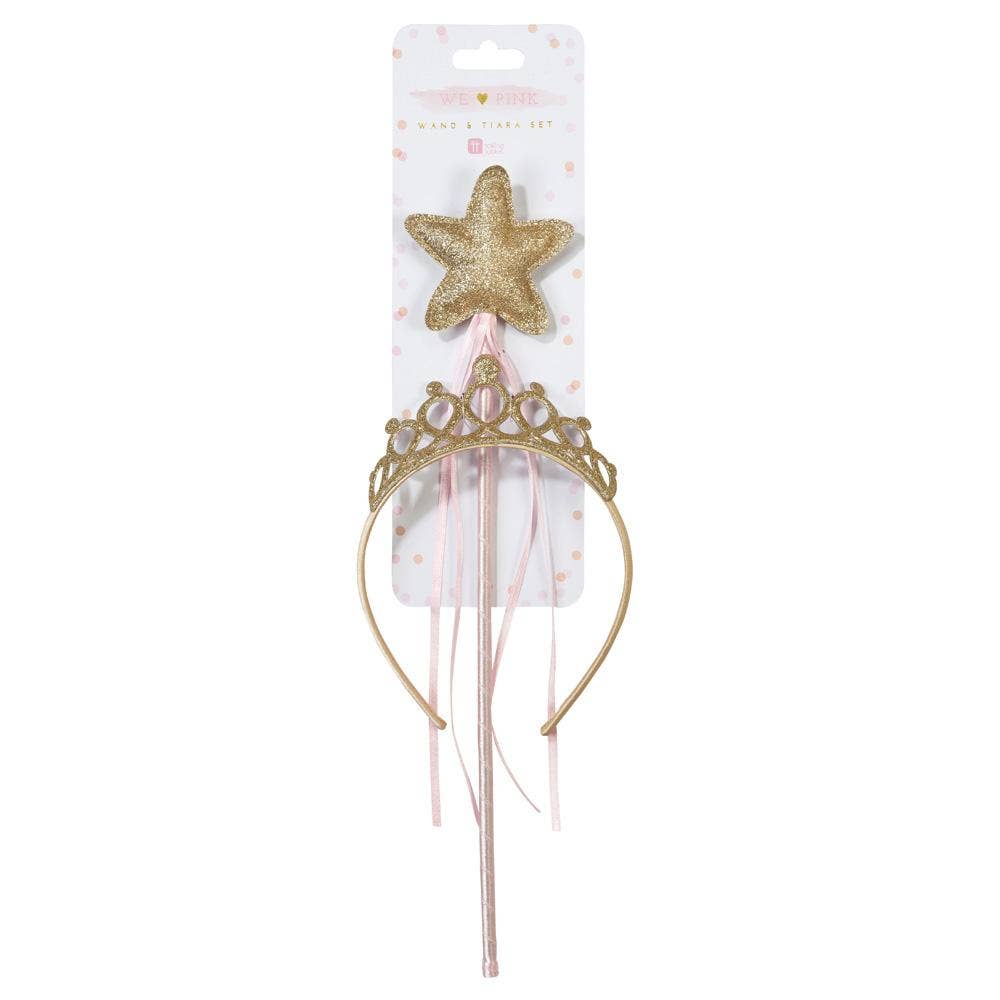 Gold tiara and star-shaped wand on a white background with packaging.