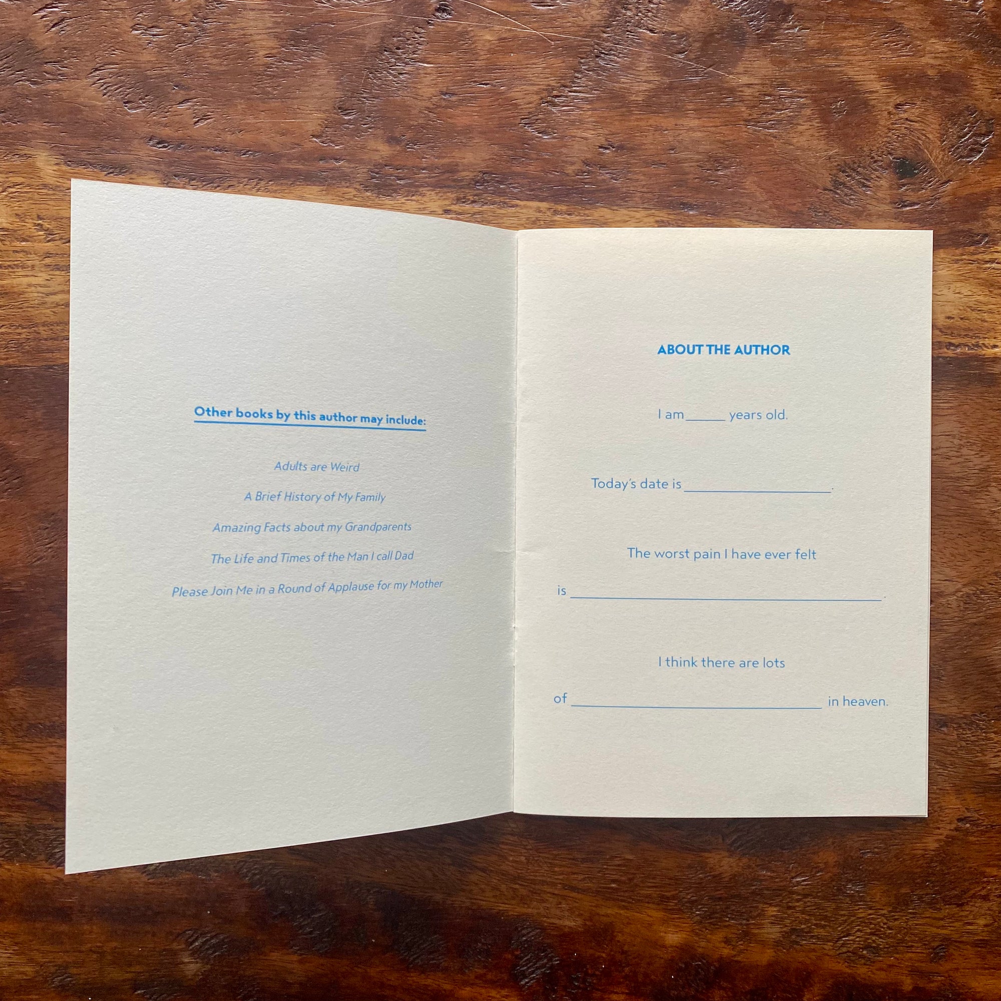 Open book with text on a wooden surface