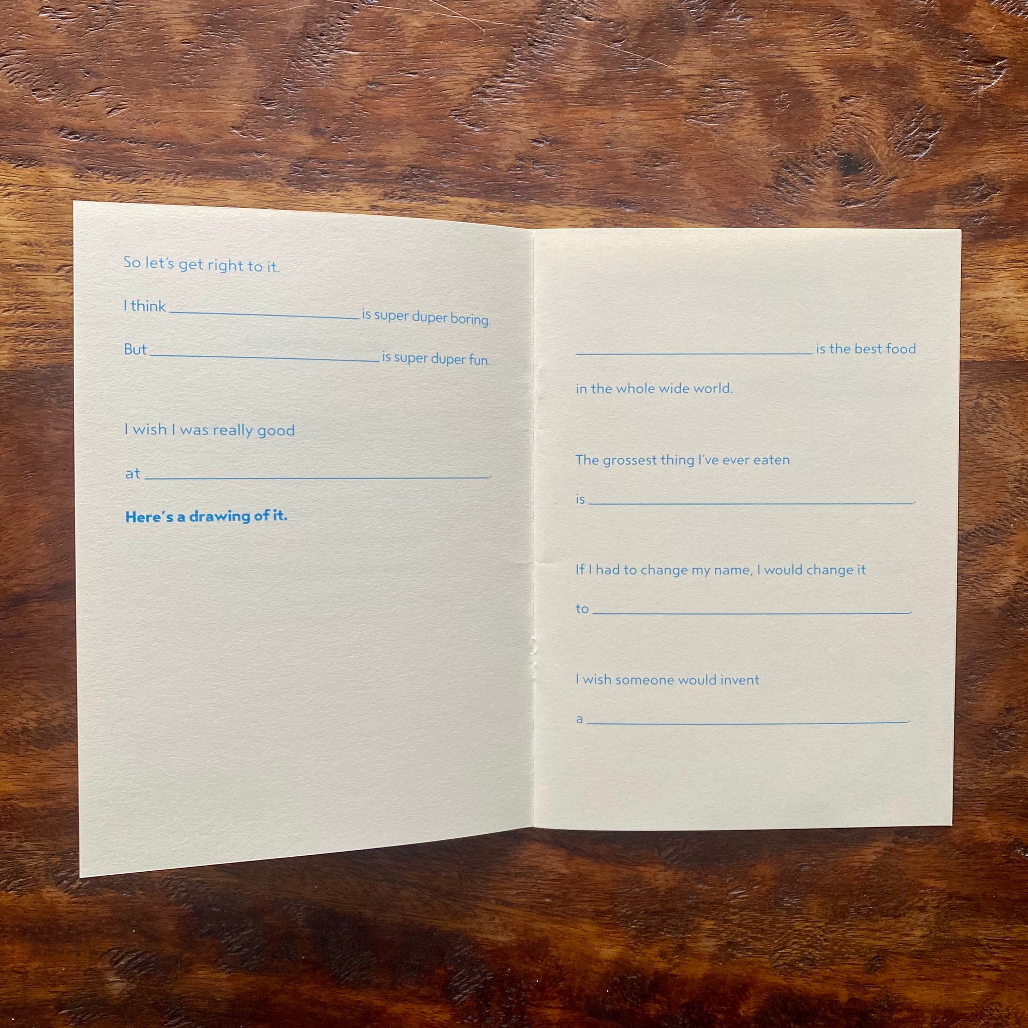 Open book with text on a wooden surface