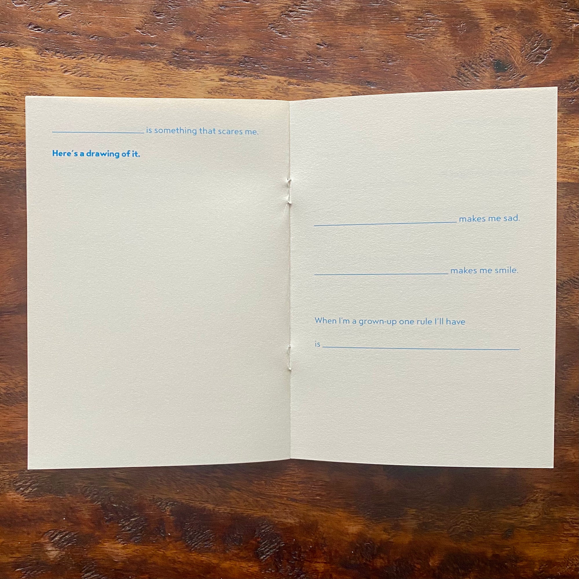 Open book with text on a wooden surface