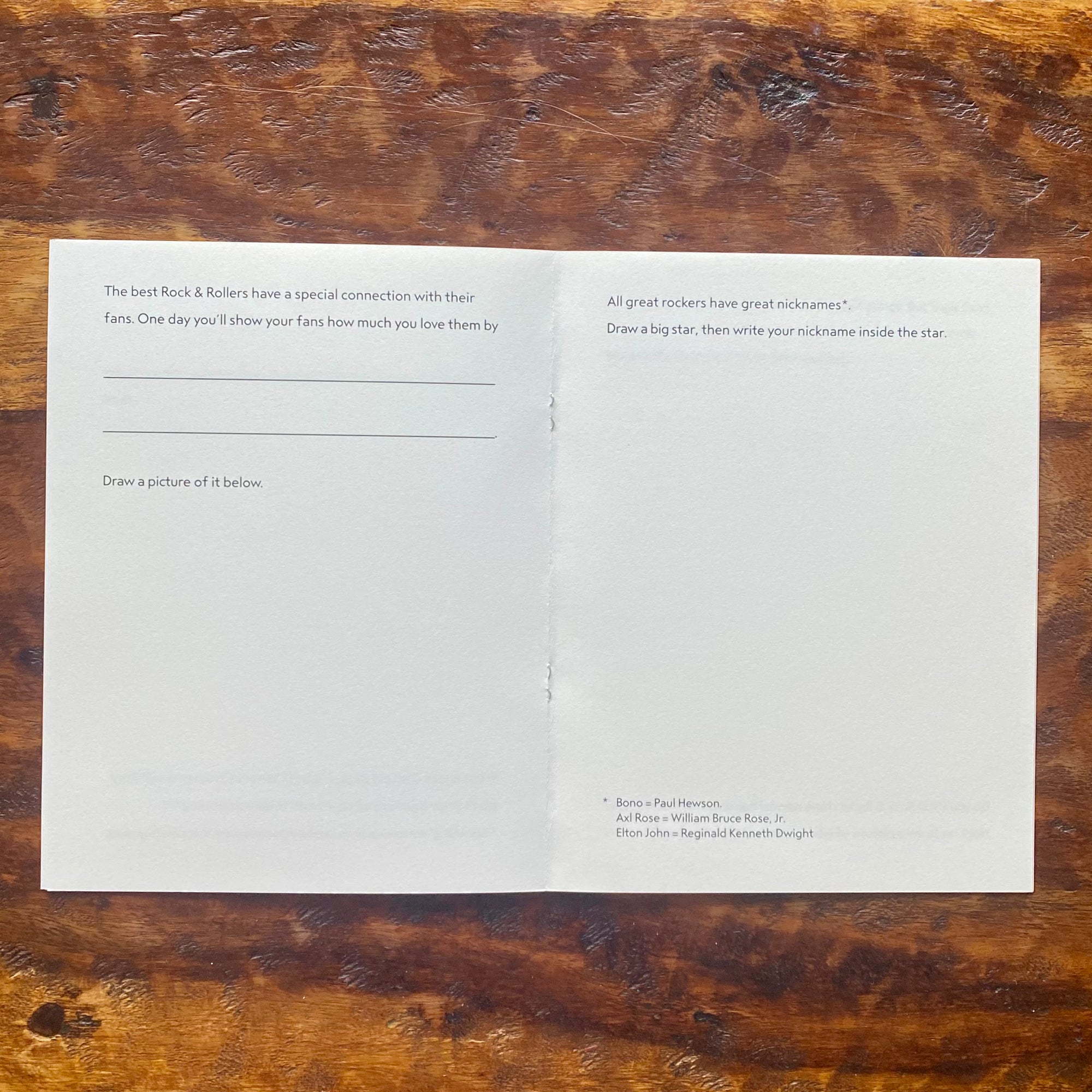 Open book with text on a wooden surface