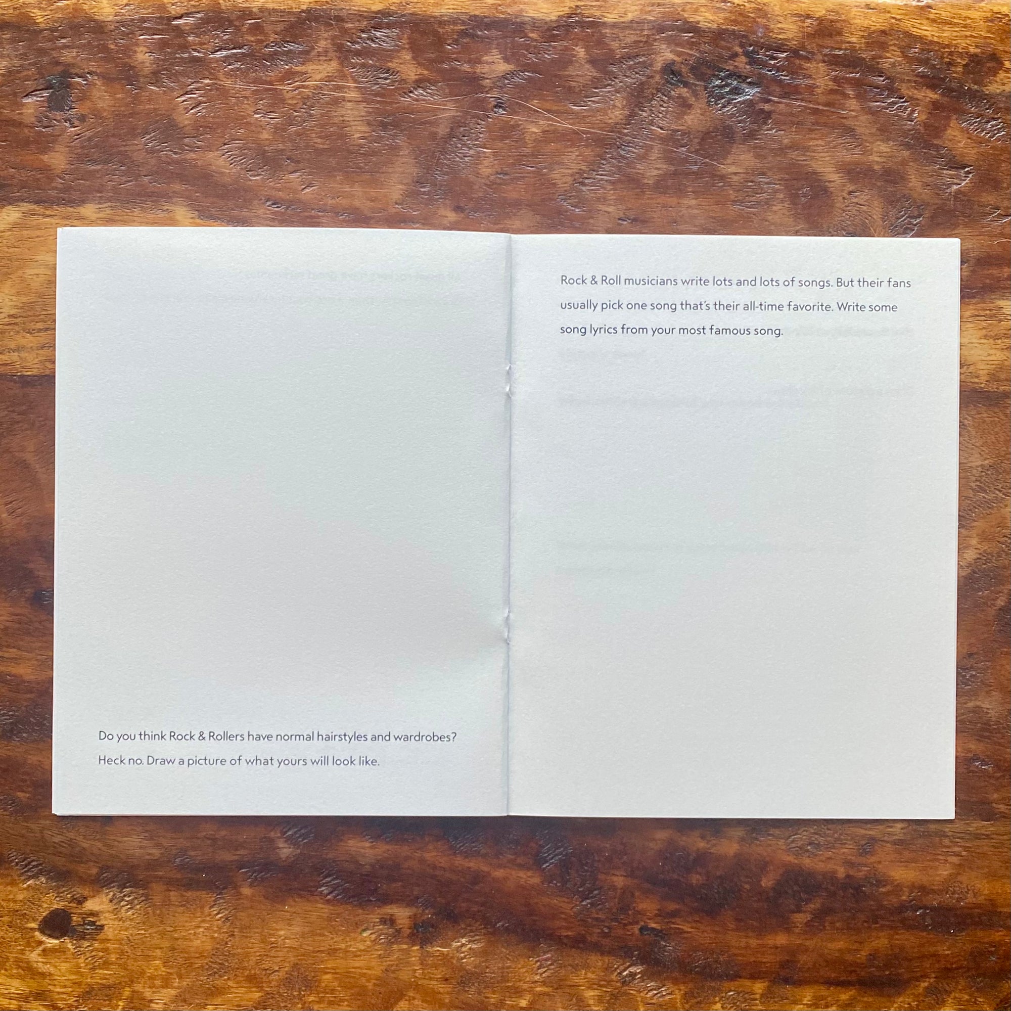 Open book on a wooden surface with text on each page.