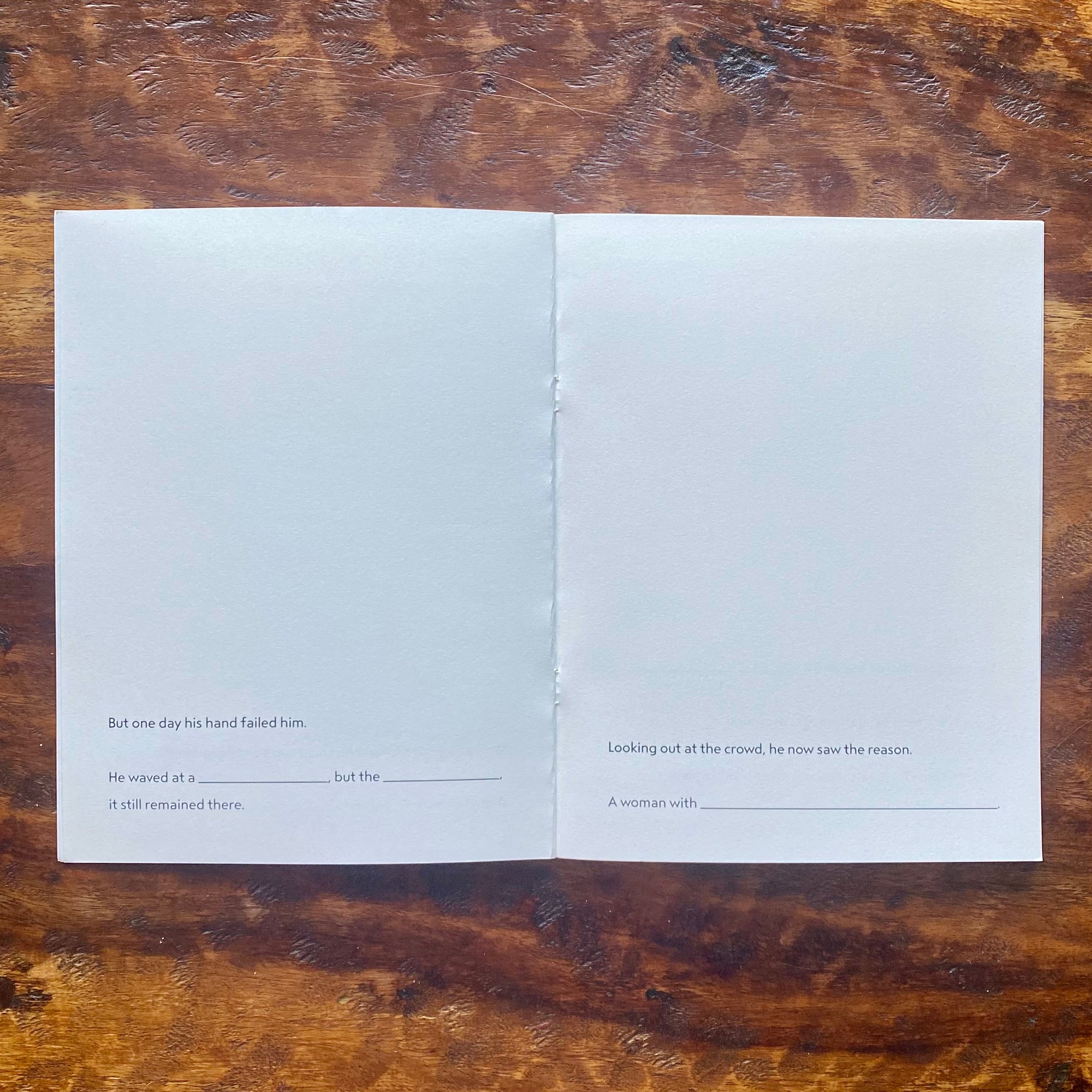 Open book with text on a wooden surface