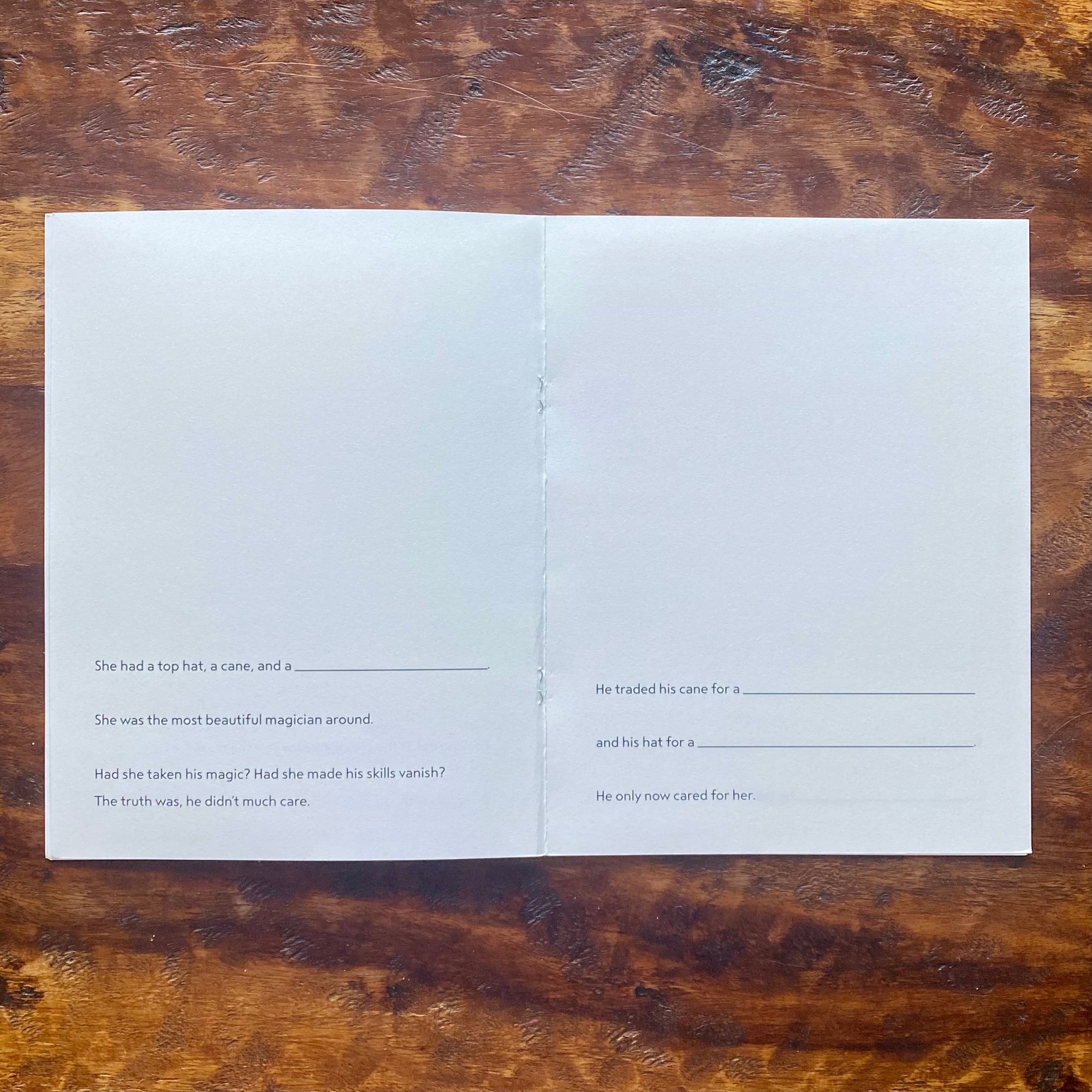Open book with text on a wooden surface