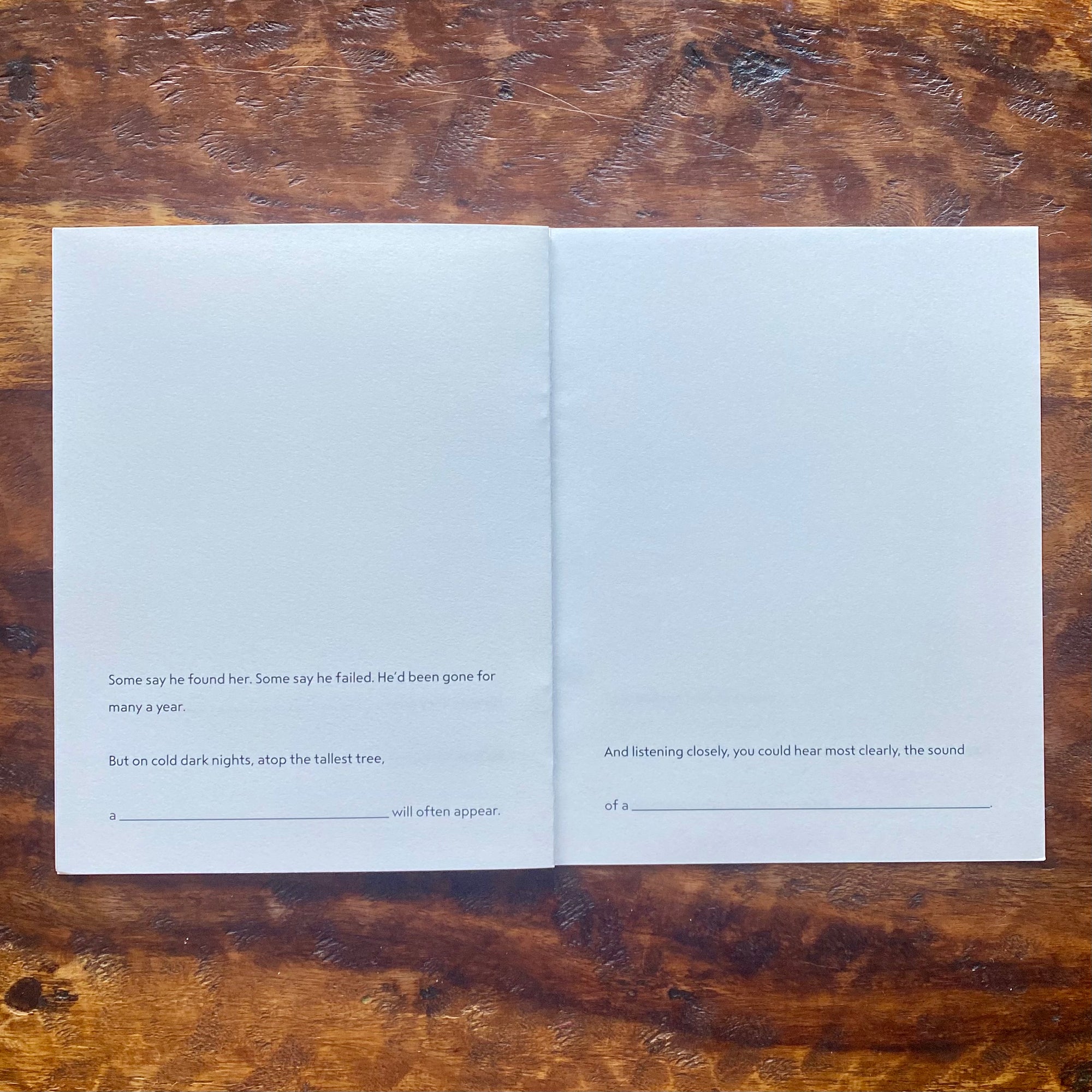 Open book with text on a wooden surface
