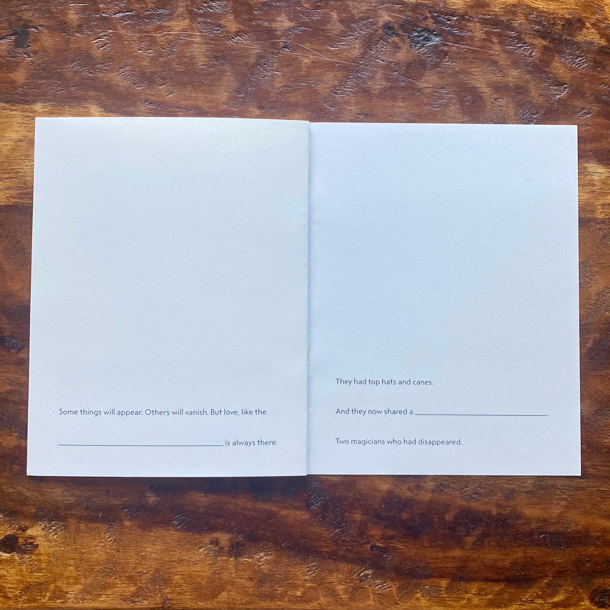 Open book with text on a wooden surface