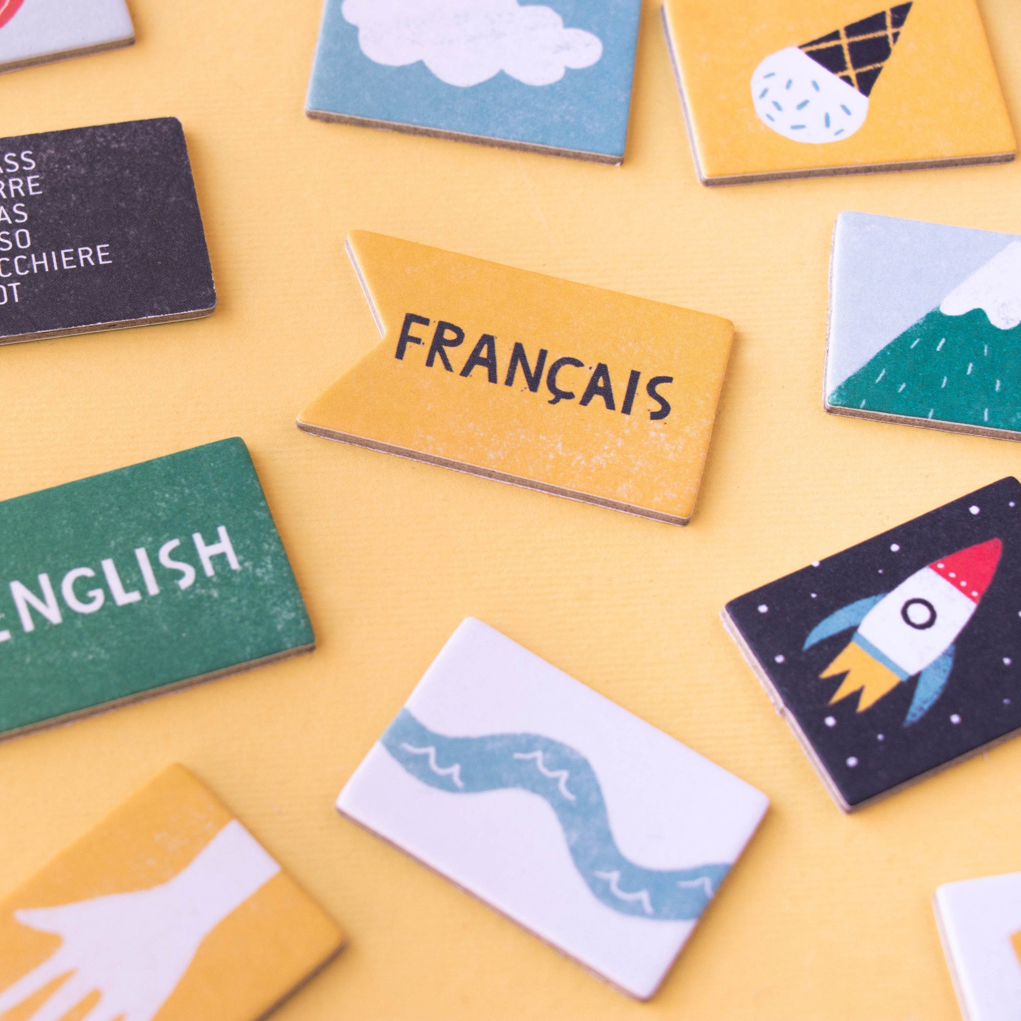 Collection of colorful educational flashcards on a yellow background