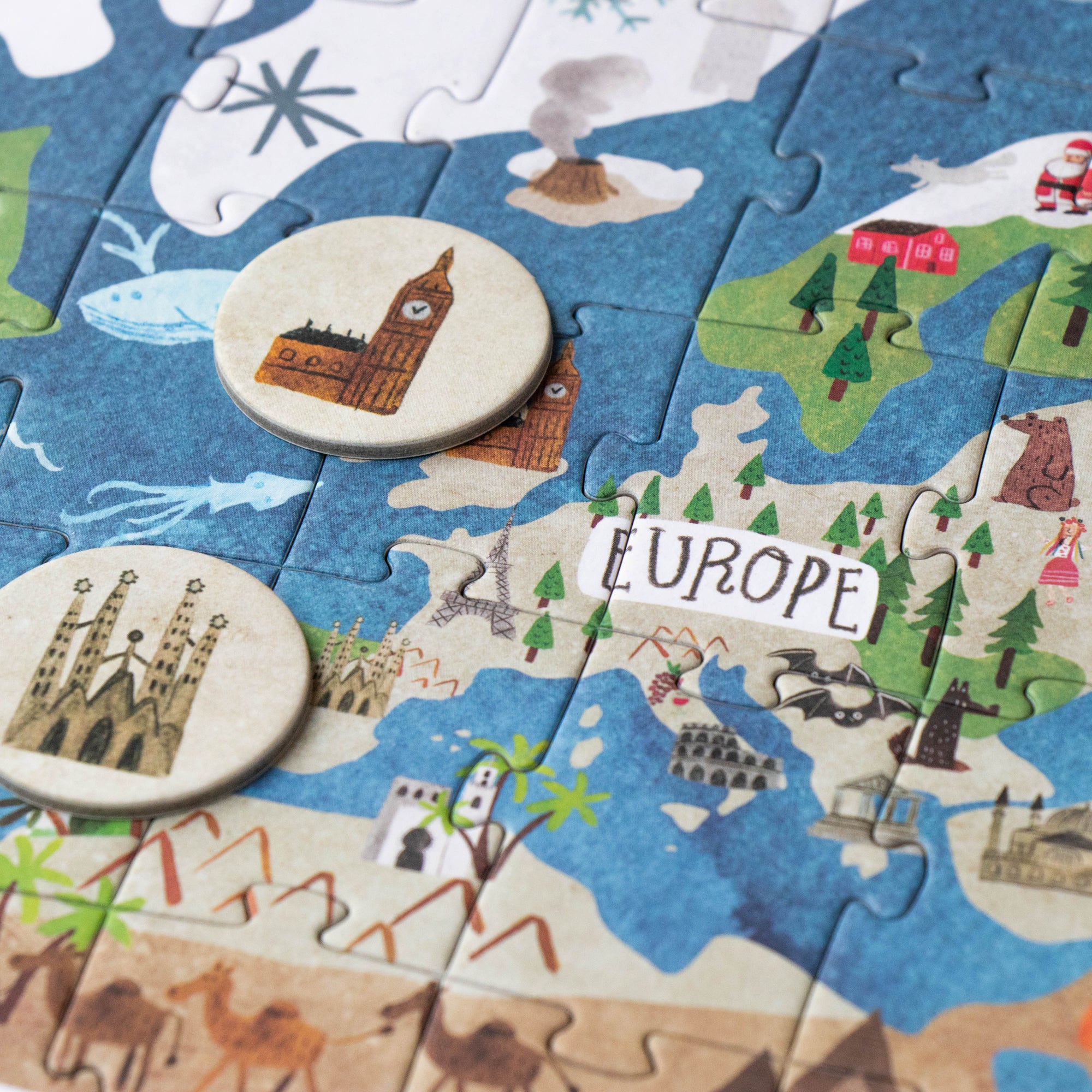 Children's puzzle with a map of Europe featuring landmarks and countries.