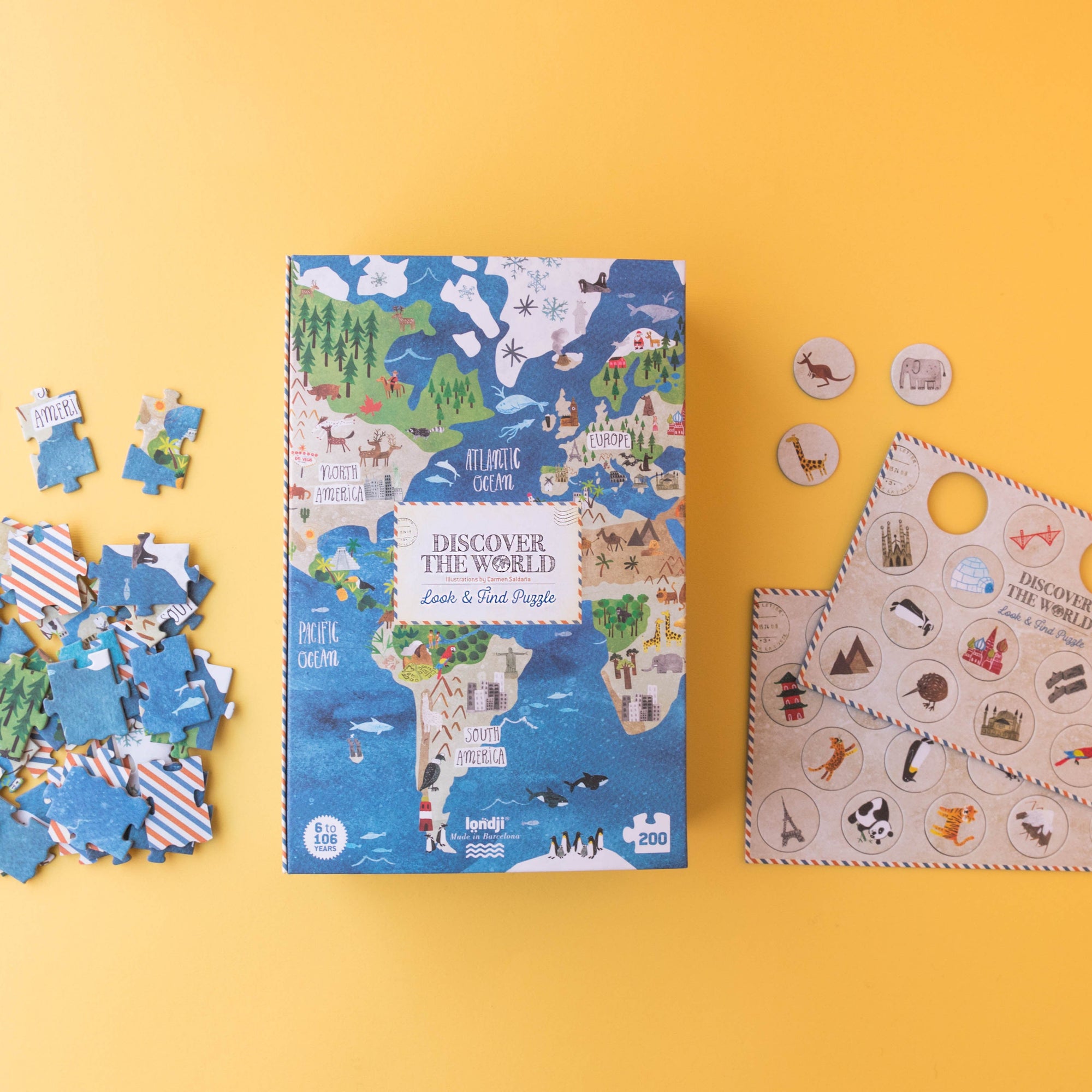 Children's puzzle set with world map design on a yellow background