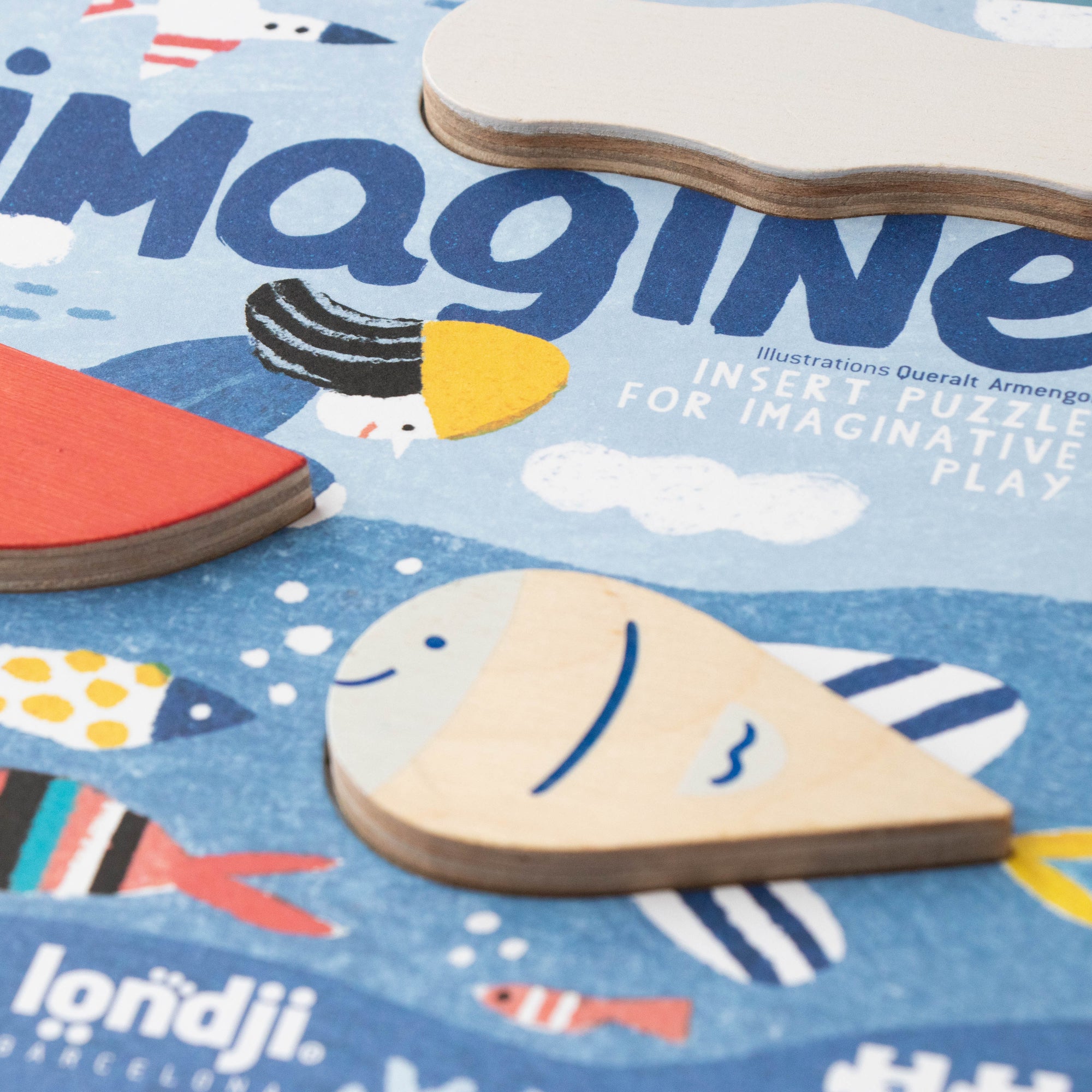 Children's educational toy with wooden shapes and fish illustrations on a blue background, featuring the brand 'londji'.