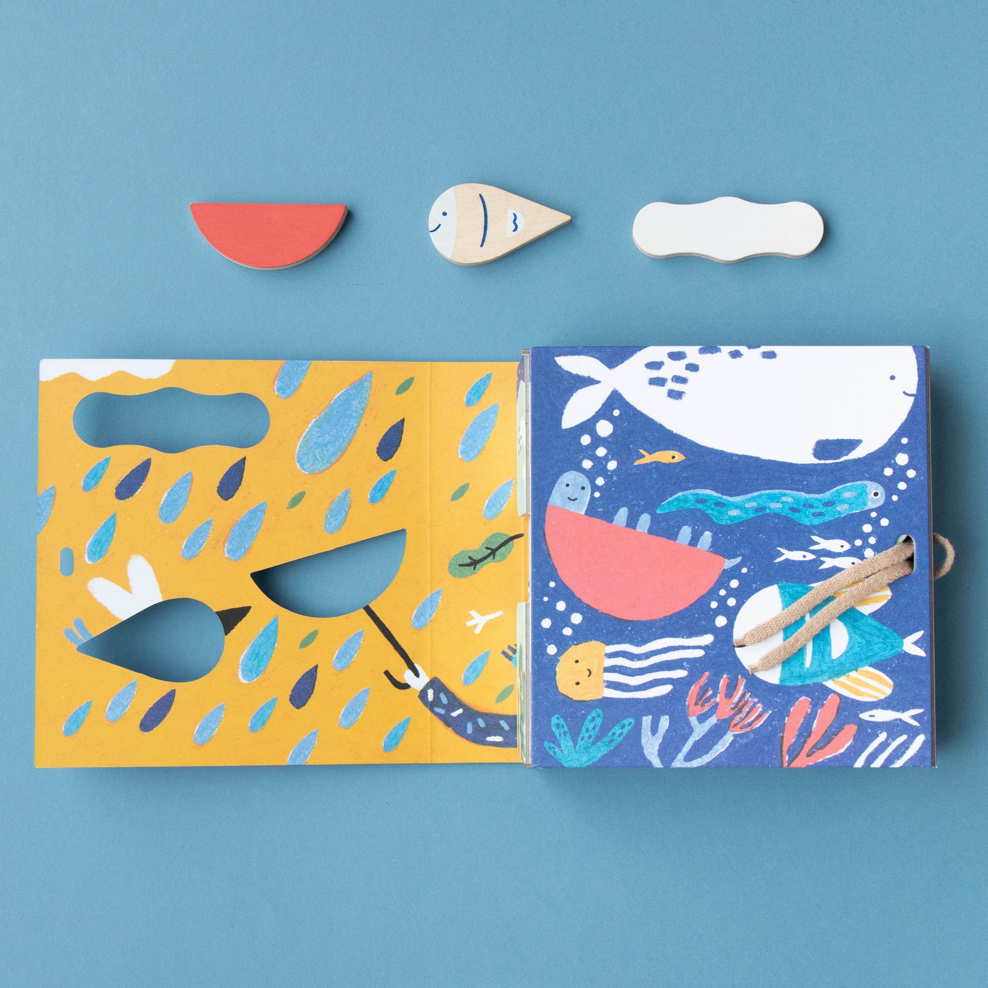 Two colorful children's illustrations with cut-out animal shapes on a blue background