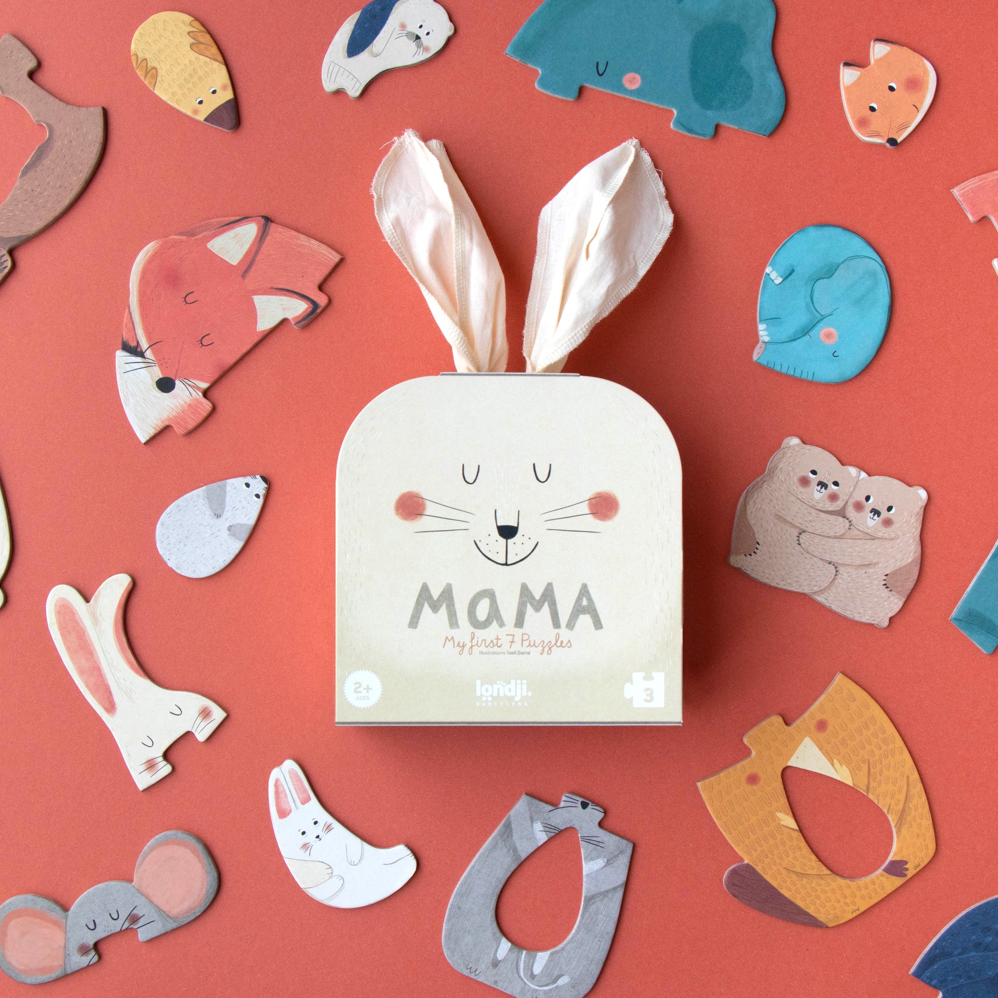 Box labeled 'MAMA' surrounded by various animal-shaped cutouts on a red background