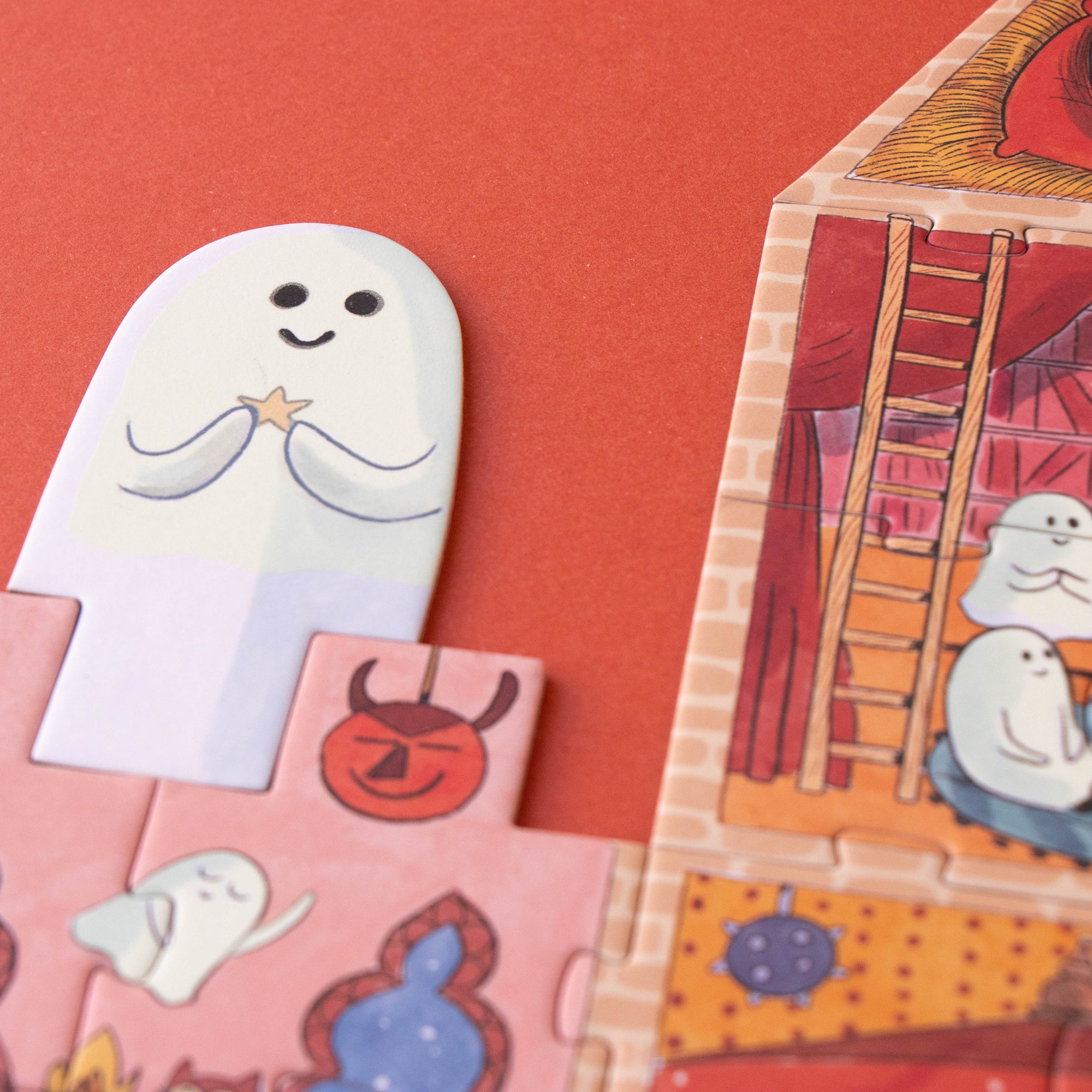 Children's puzzle with cartoon ghost characters on a red background