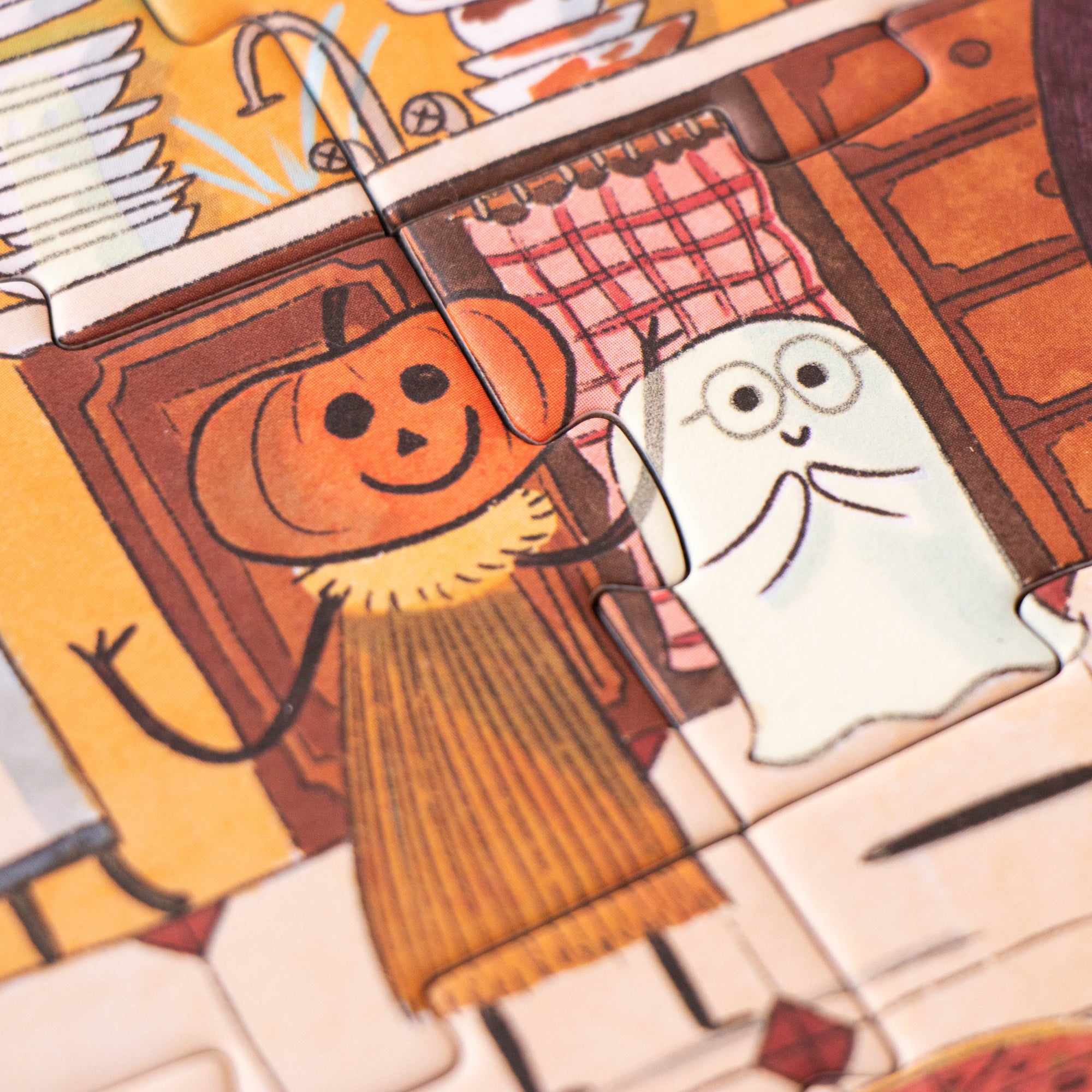 Cartoon pumpkin and ghost in a kitchen setting with autumn decorations.