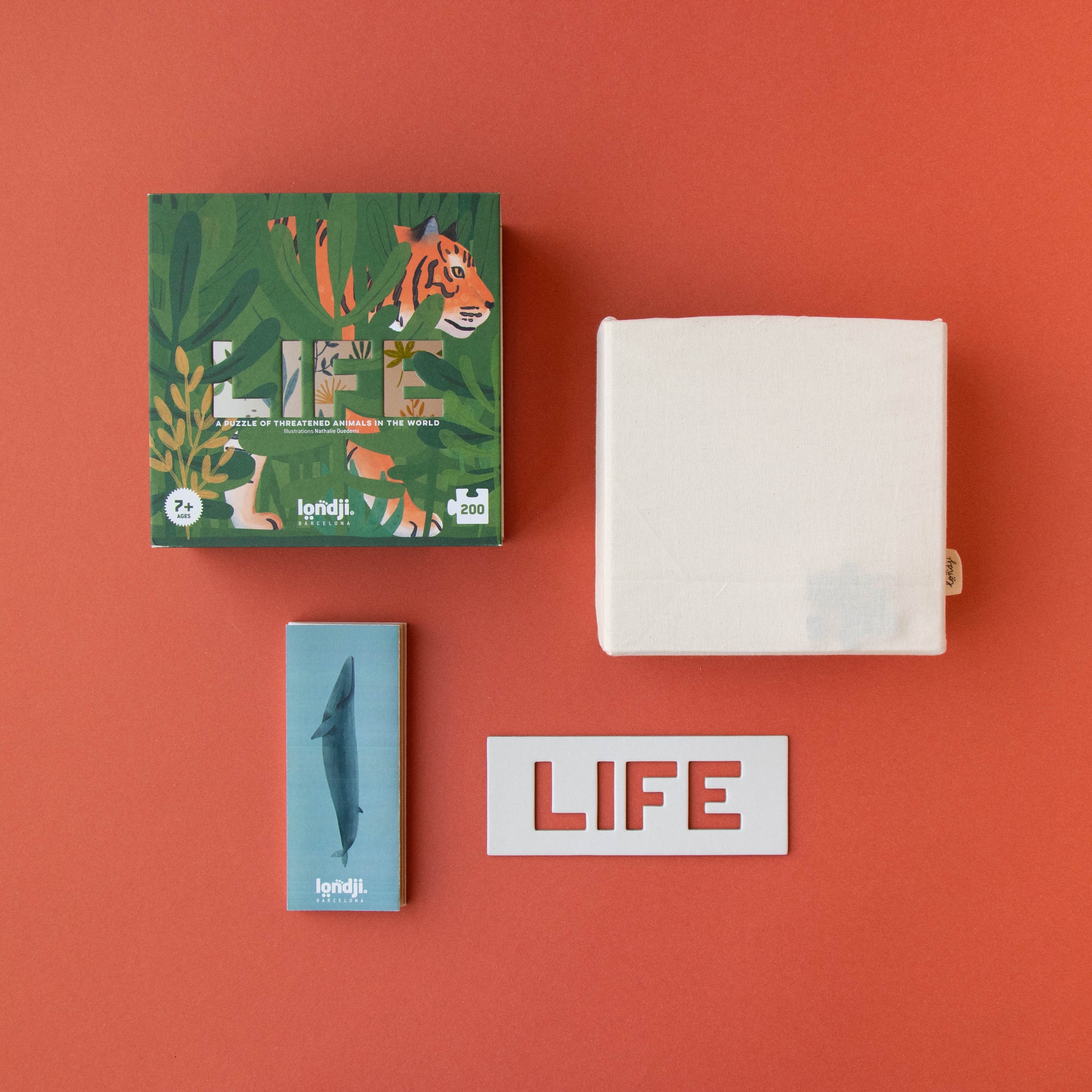 Collection of 'LIFE' branded products on a red background