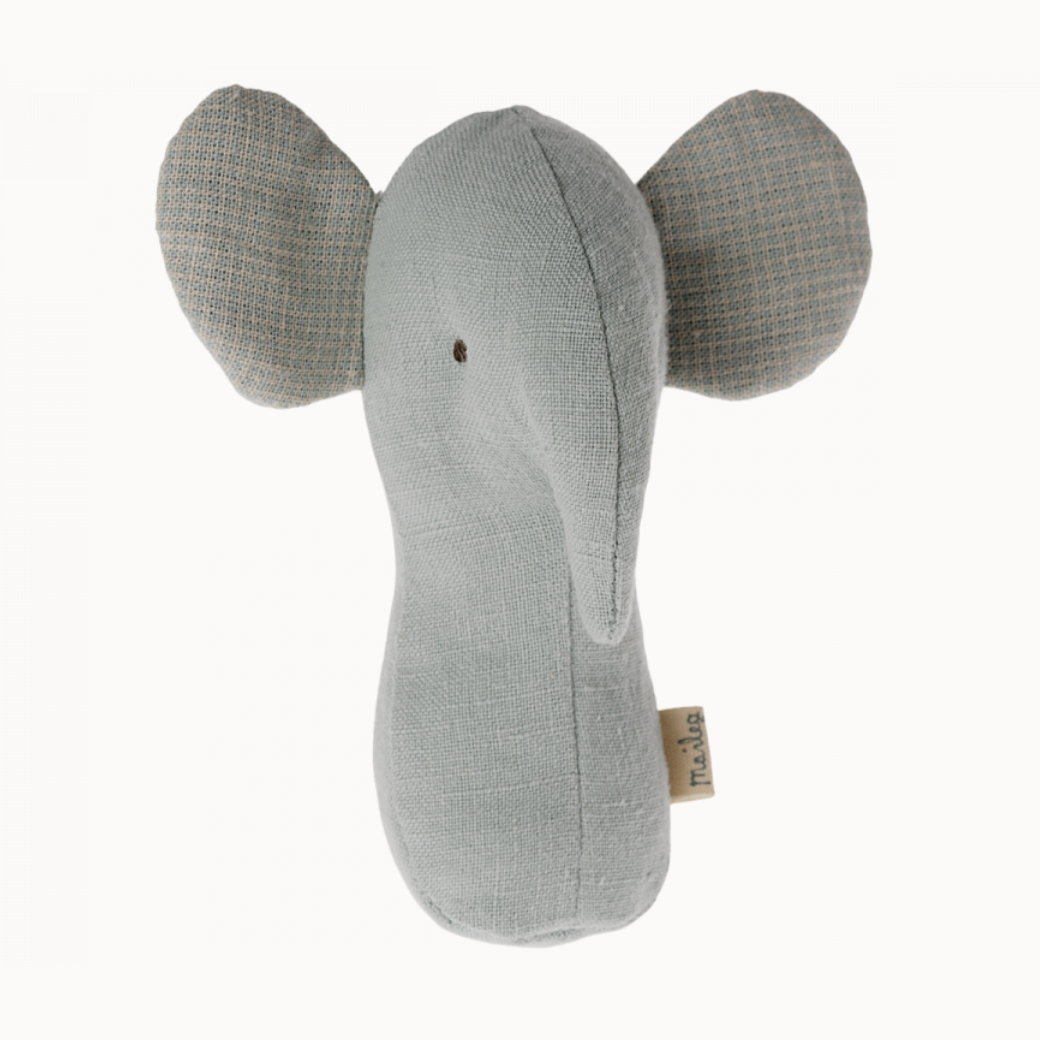 A soft fabric elephant rattle in a light dusty blue color with patterned ears, designed for small hands.